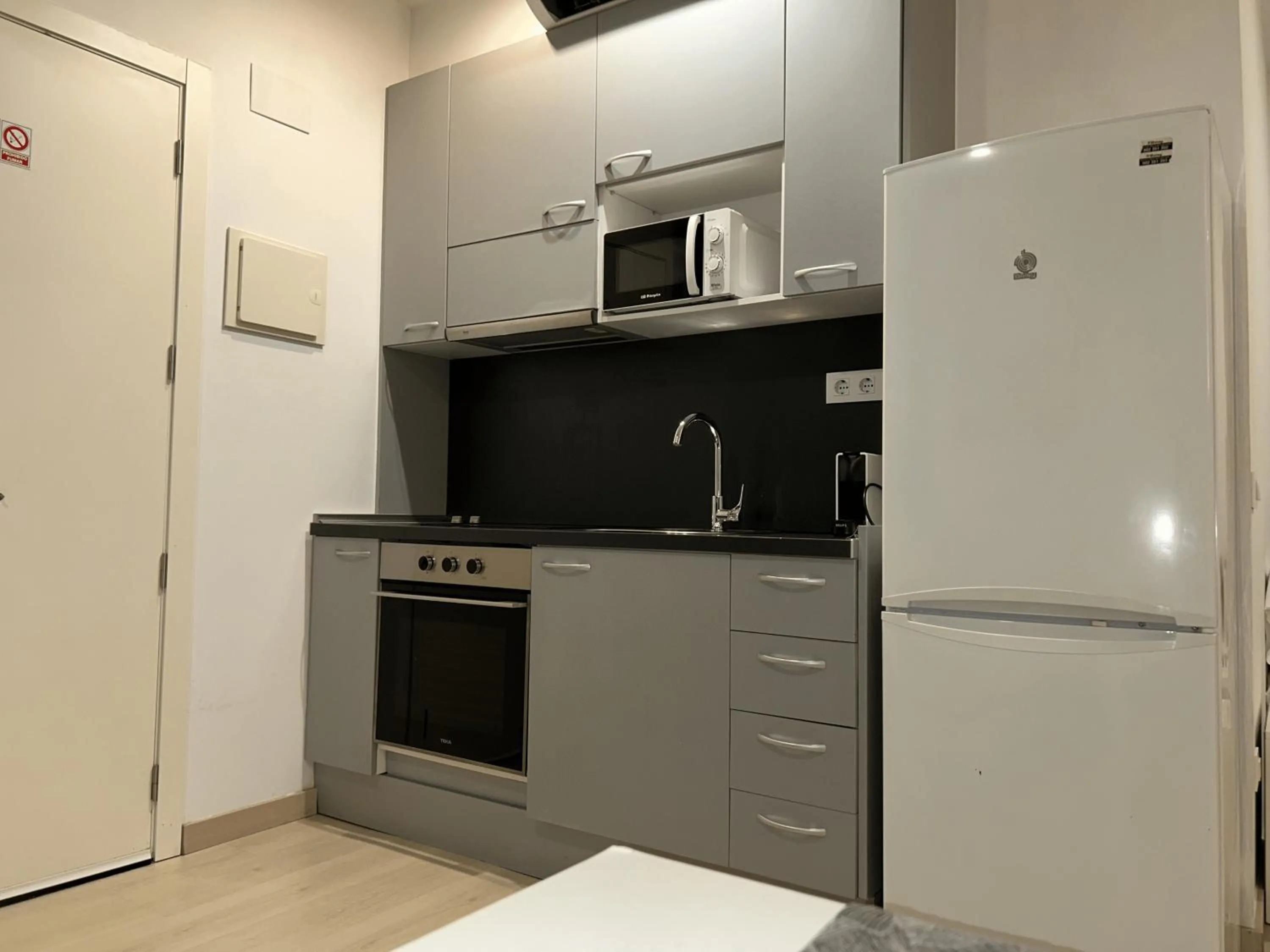 Kitchen or kitchenette in Apartahotel Baldiri