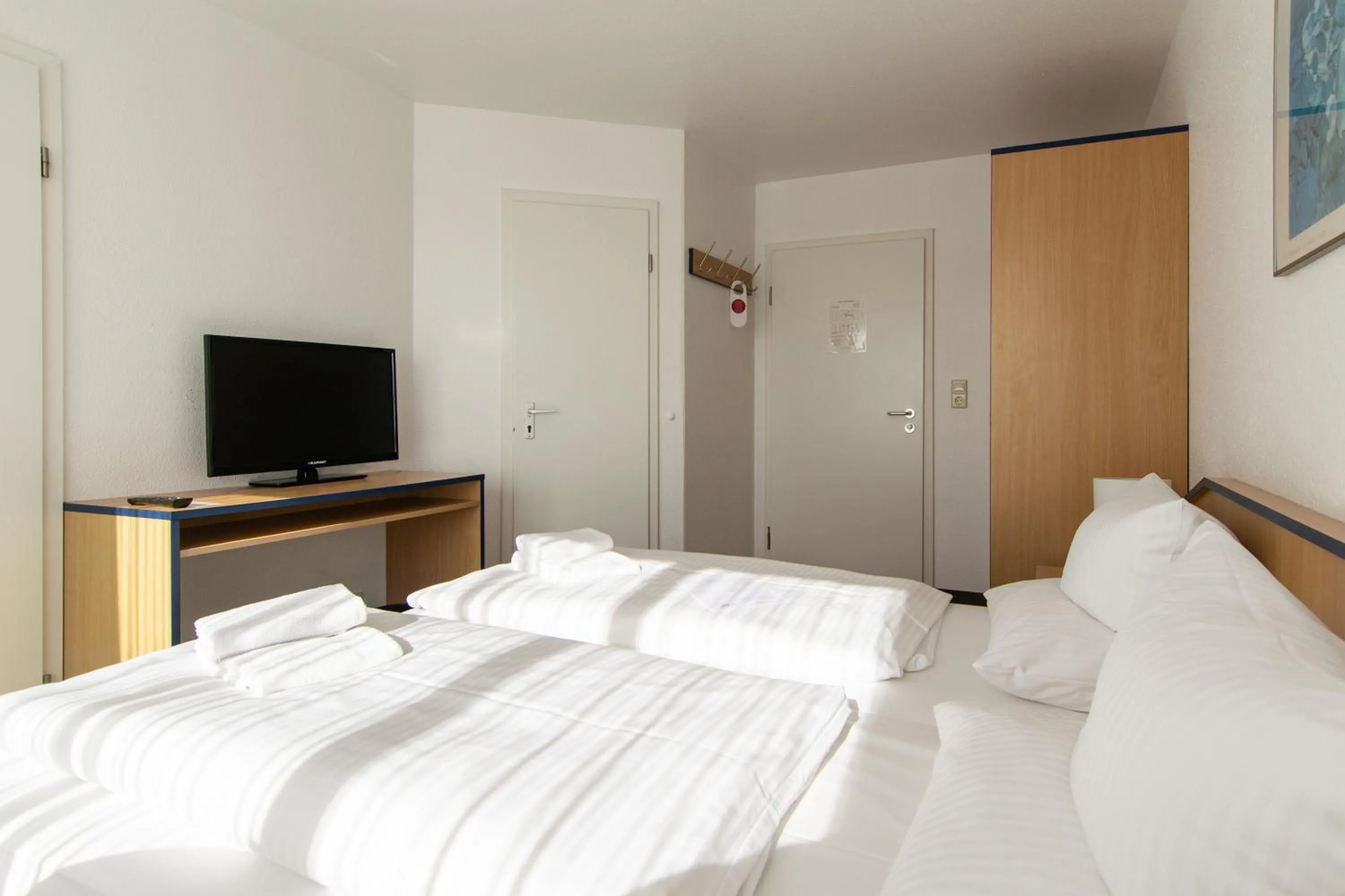 Photo of the whole room, Bed in Strandhotel Bansiner Hof