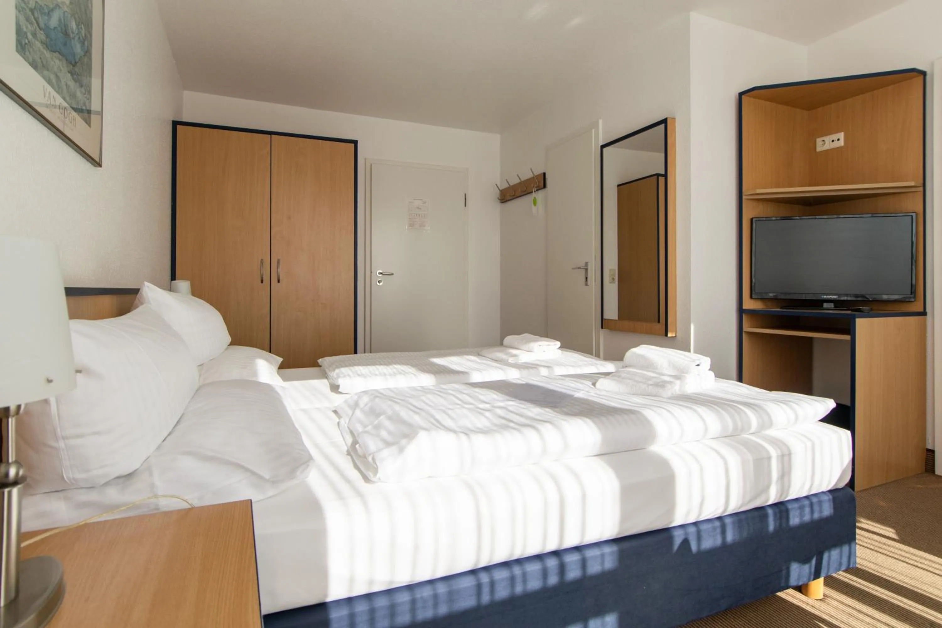 Photo of the whole room, Bed in Strandhotel Bansiner Hof