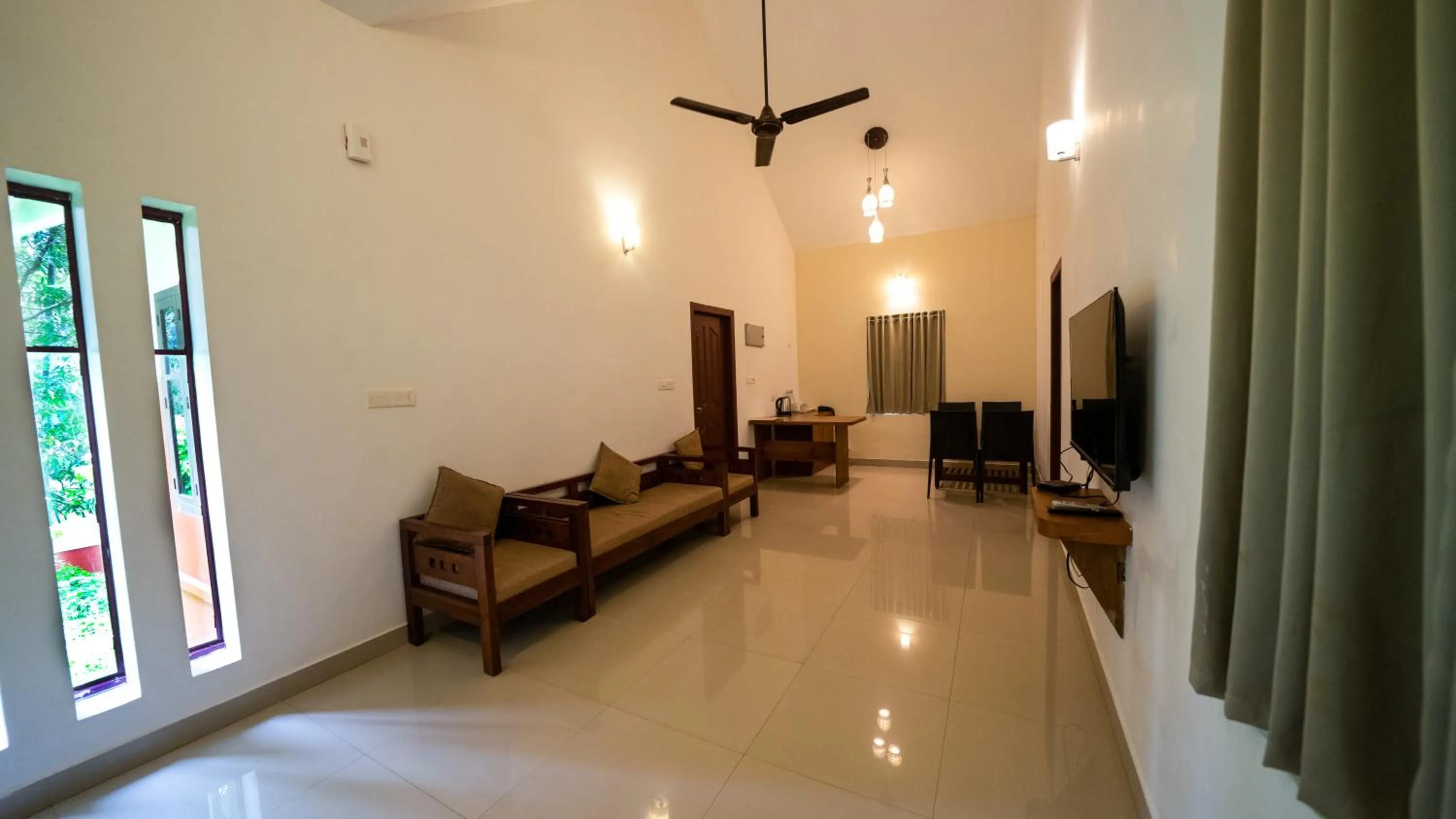 TV and multimedia in Vythiri Holiday Resort, Wayanad