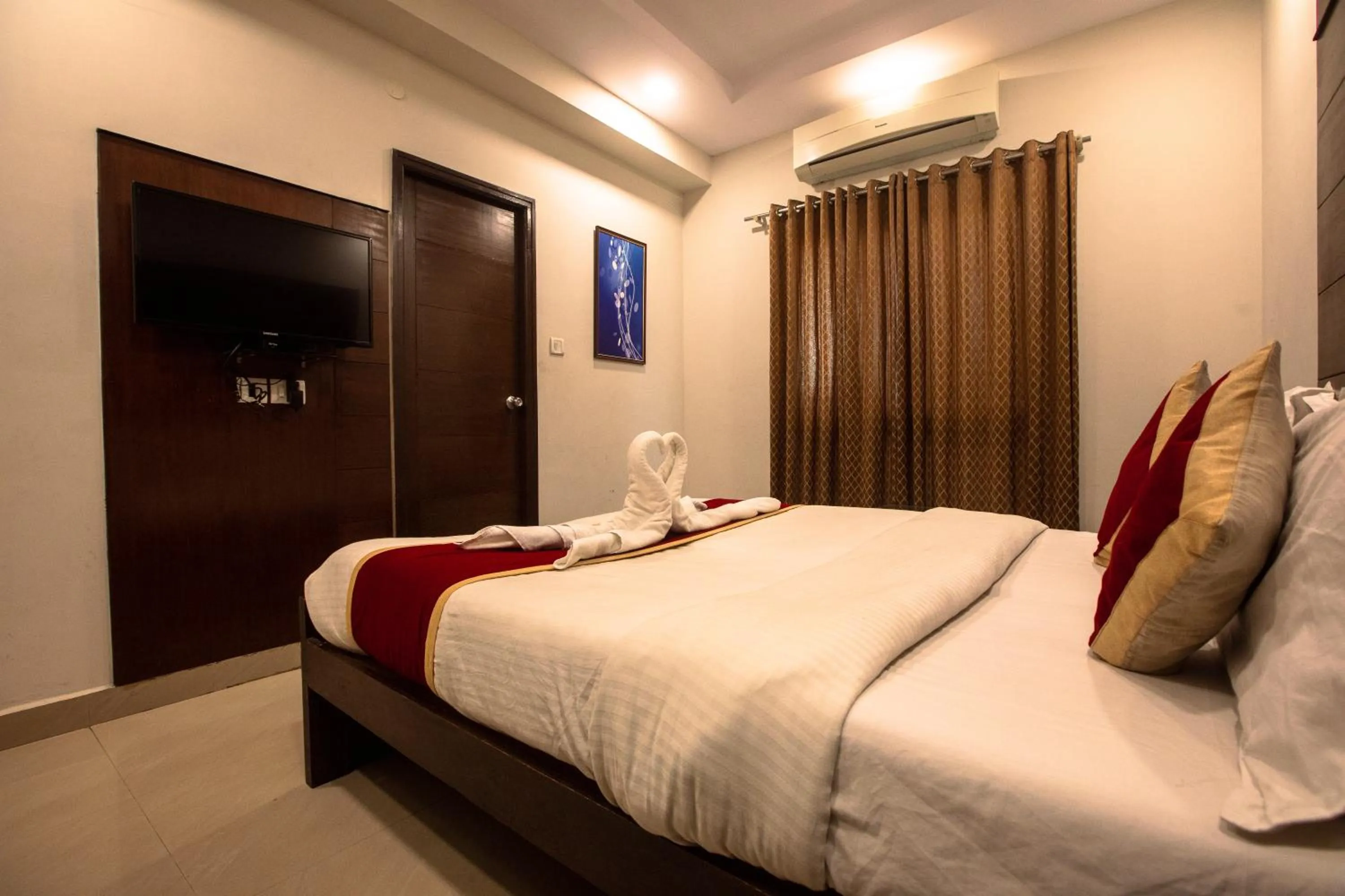 Photo of the whole room, Bed in Orion Residency Hotel Near Chennai Central Railway Station