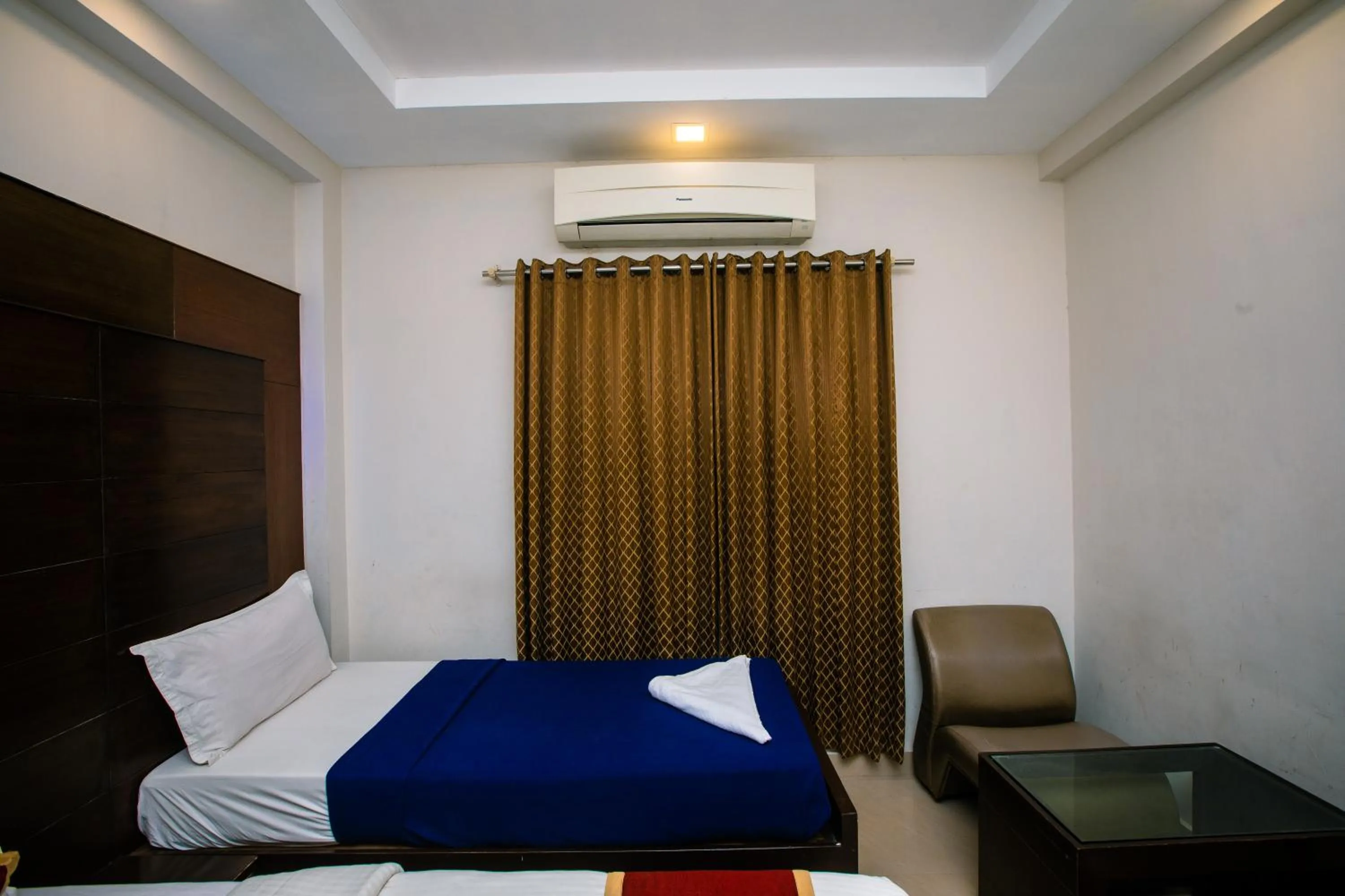 Photo of the whole room, Bed in Orion Residency Hotel Near Chennai Central Railway Station