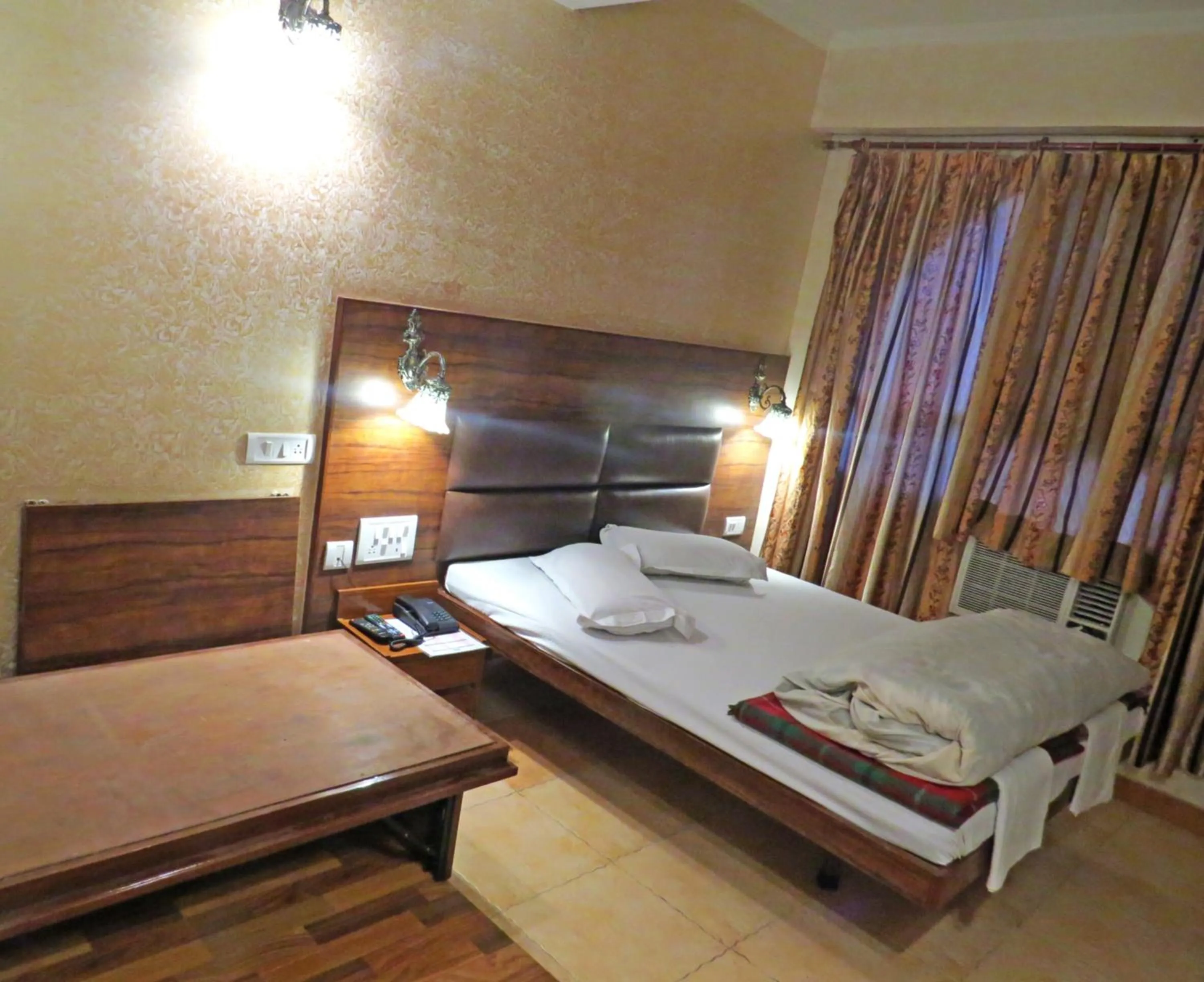 Bed in Hotel Rangoli