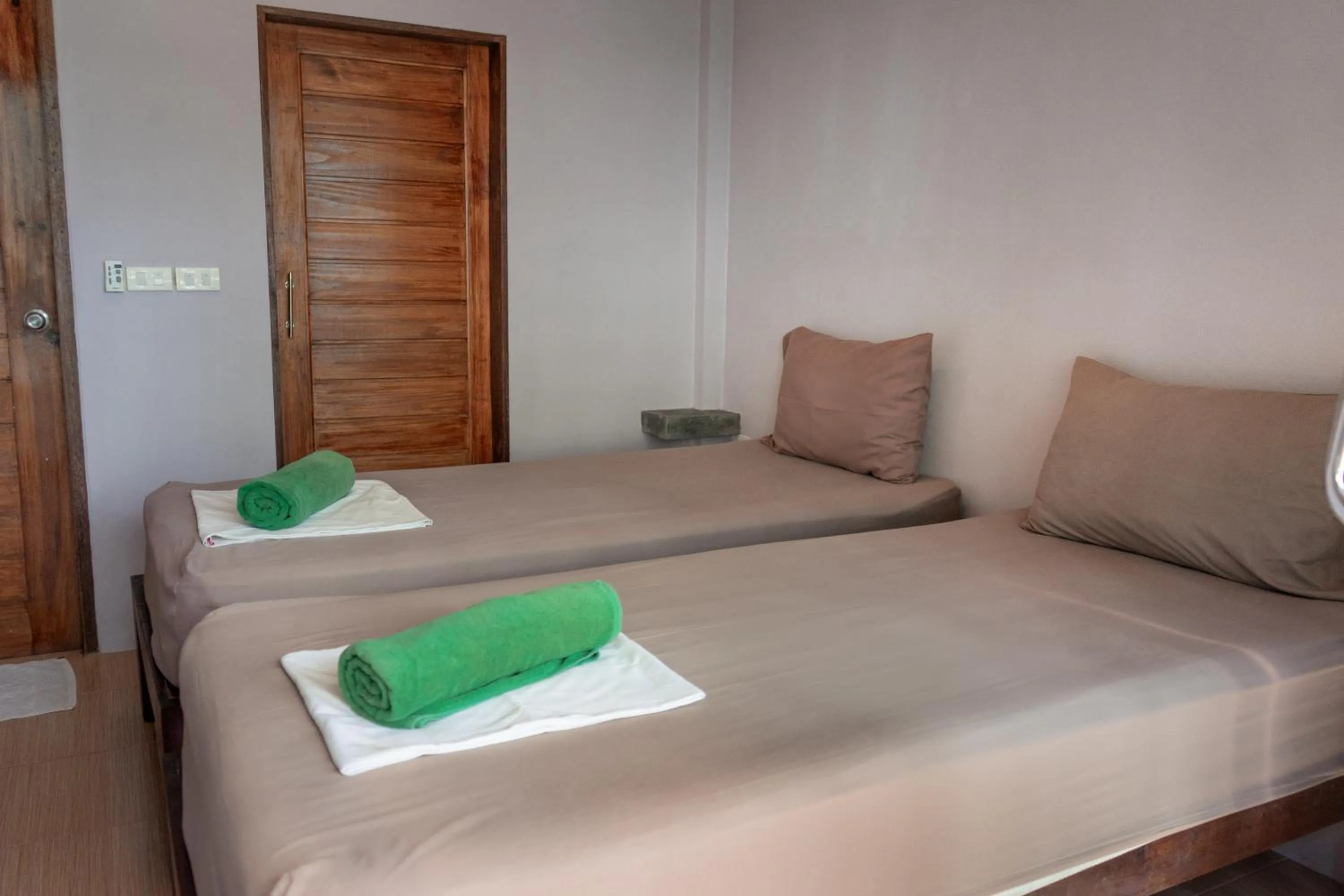 Bed in New Heaven Dive School and Resort