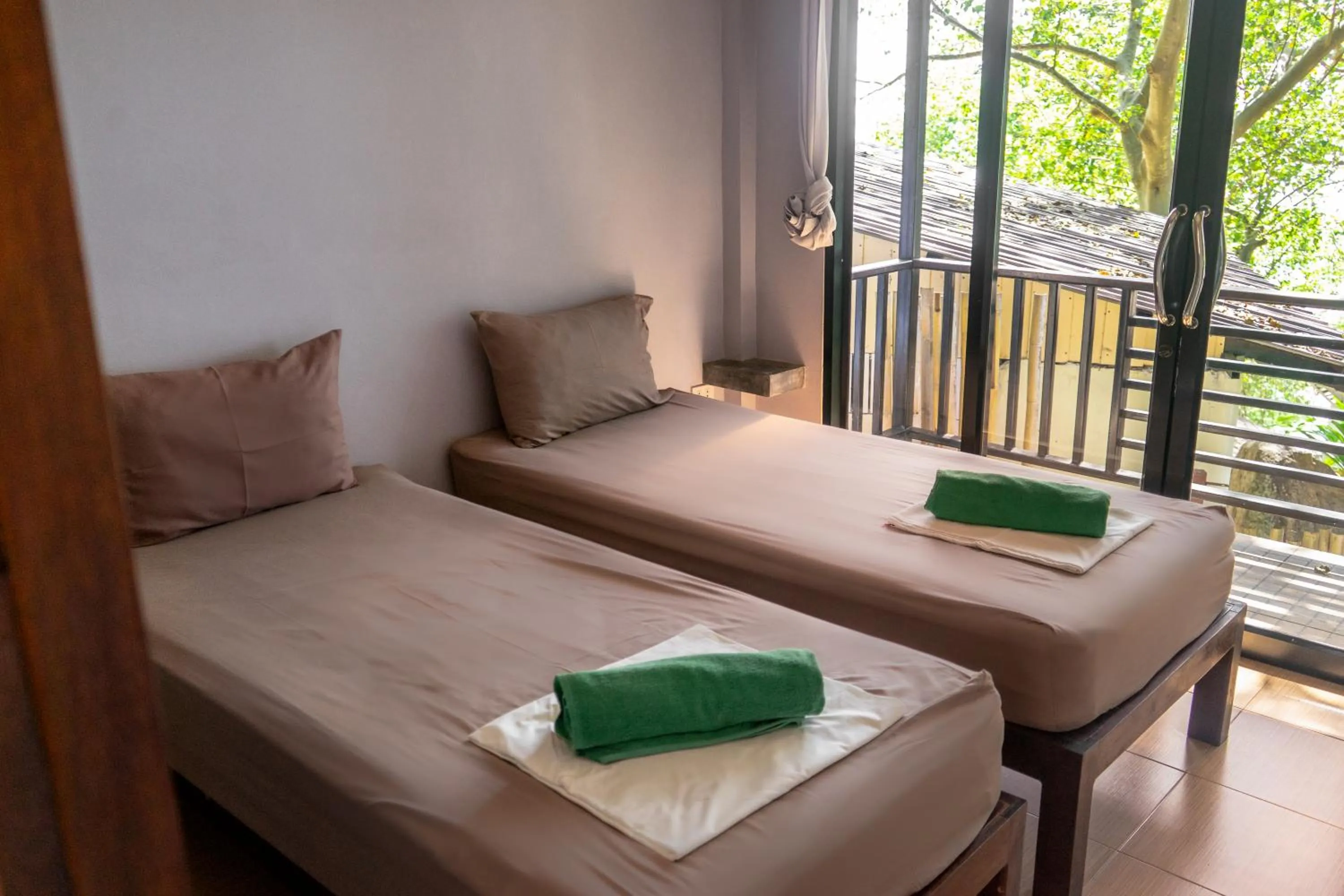 Bed in New Heaven Dive School and Resort