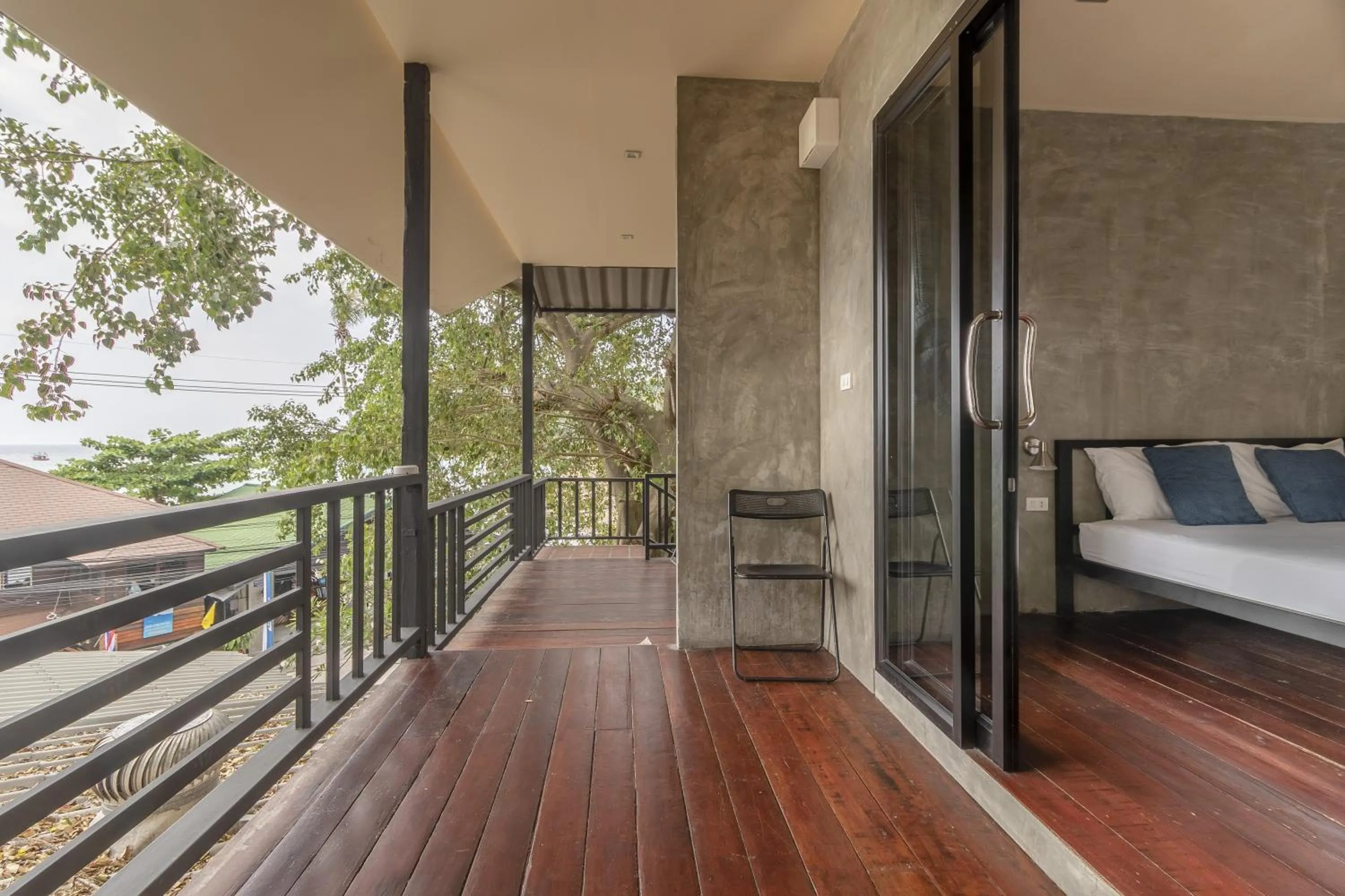 Patio, Bed in New Heaven Dive School and Resort