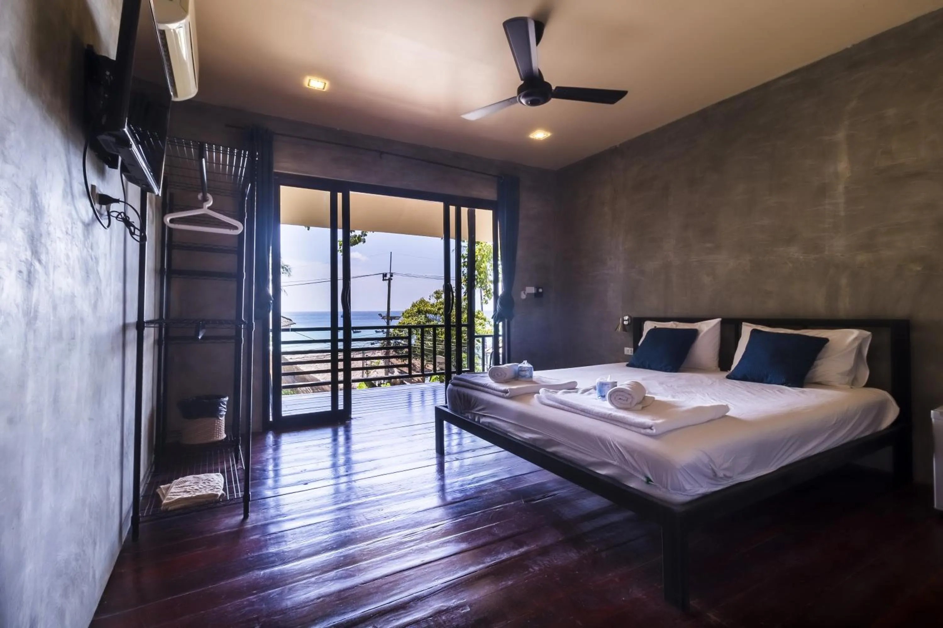 Patio, Bed in New Heaven Dive School and Resort