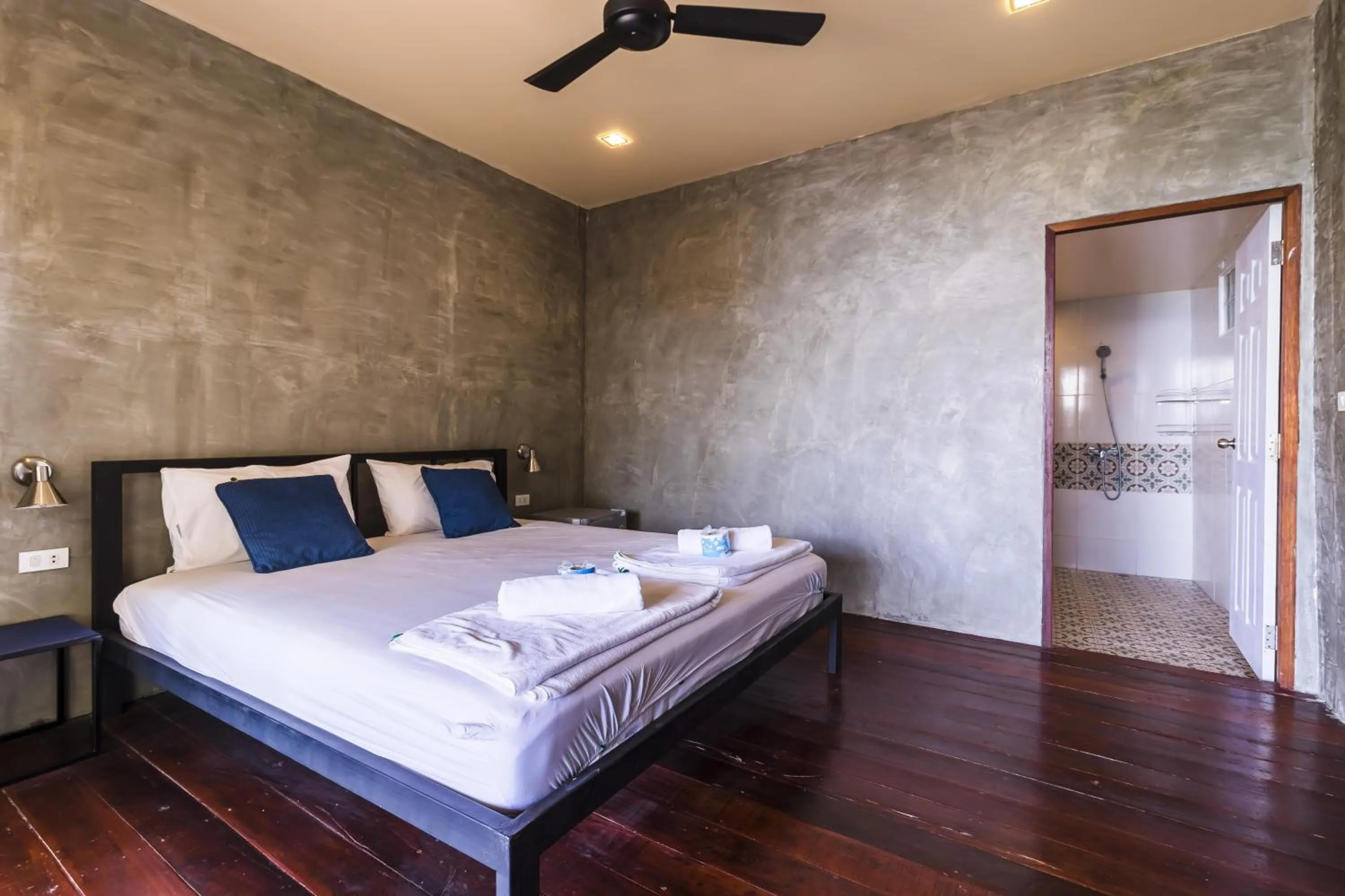 Patio, Bed in New Heaven Dive School and Resort