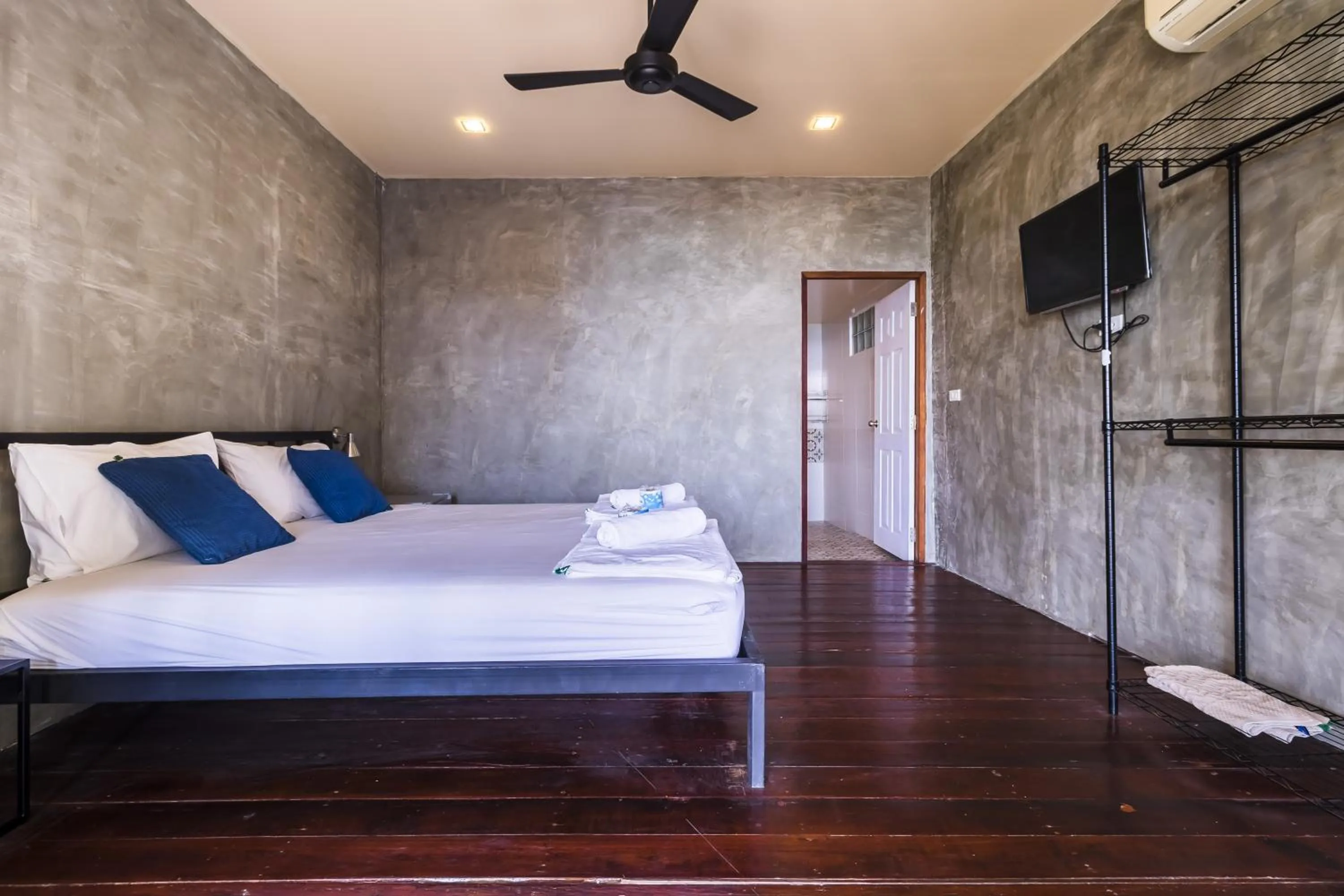 Patio, Bed in New Heaven Dive School and Resort