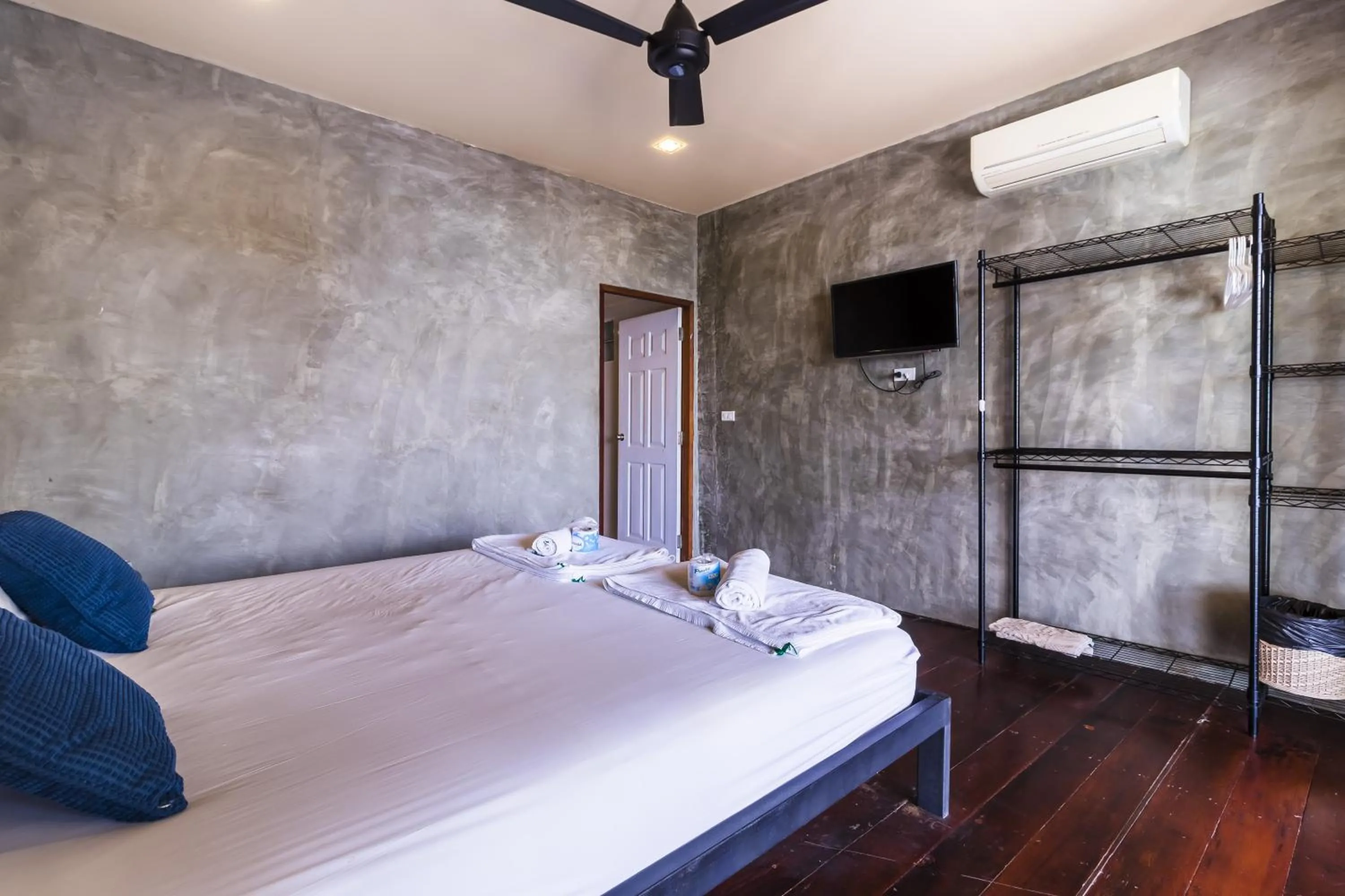 Patio, Bed in New Heaven Dive School and Resort