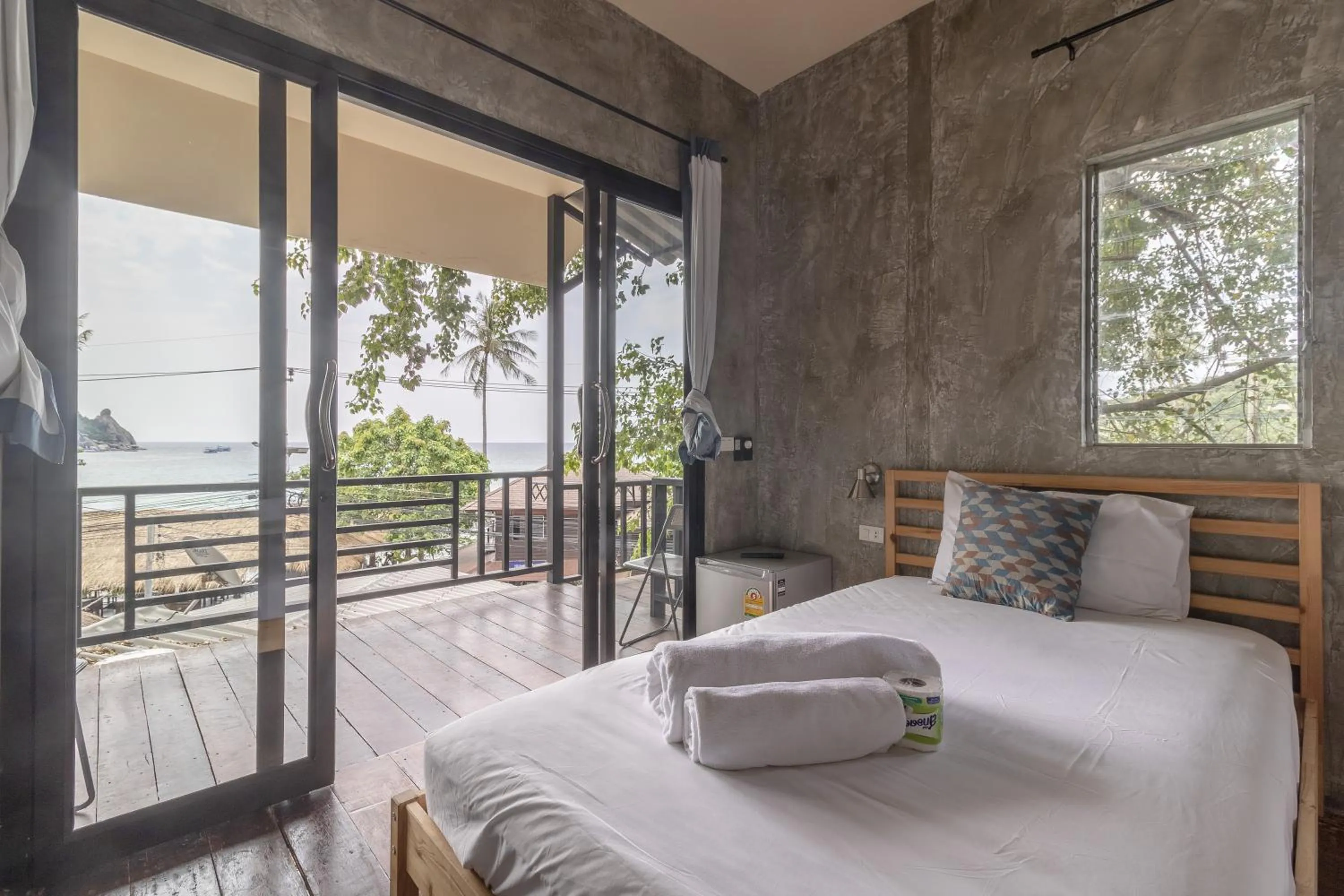 Patio, Bed in New Heaven Dive School and Resort