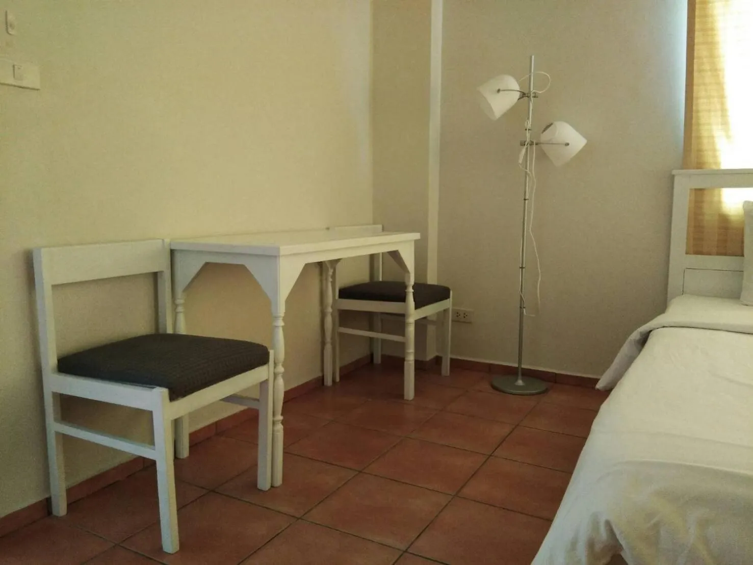 Decorative detail, Bed in Lomsabai Apartments