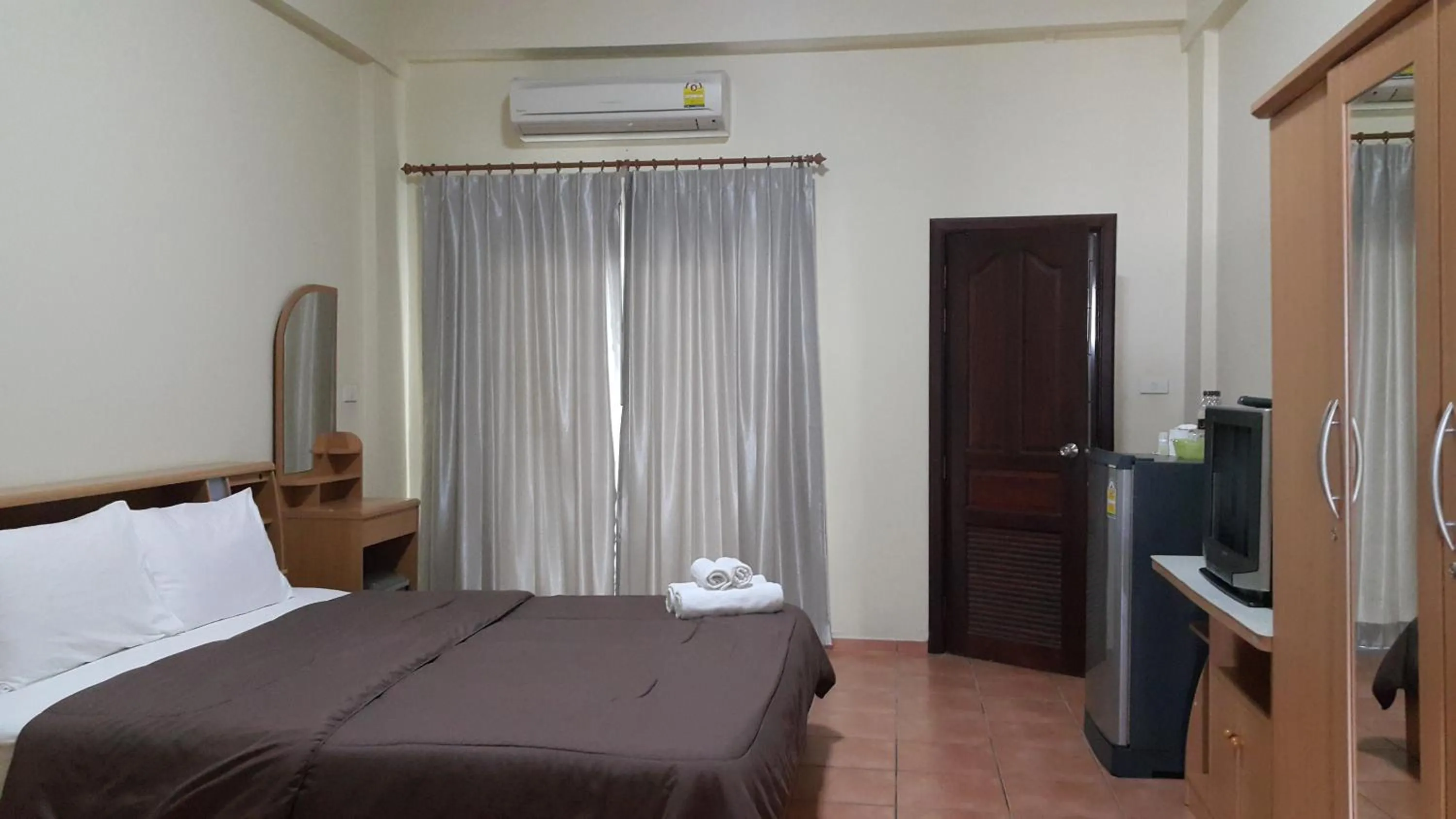 Decorative detail, Bed in Lomsabai Apartments