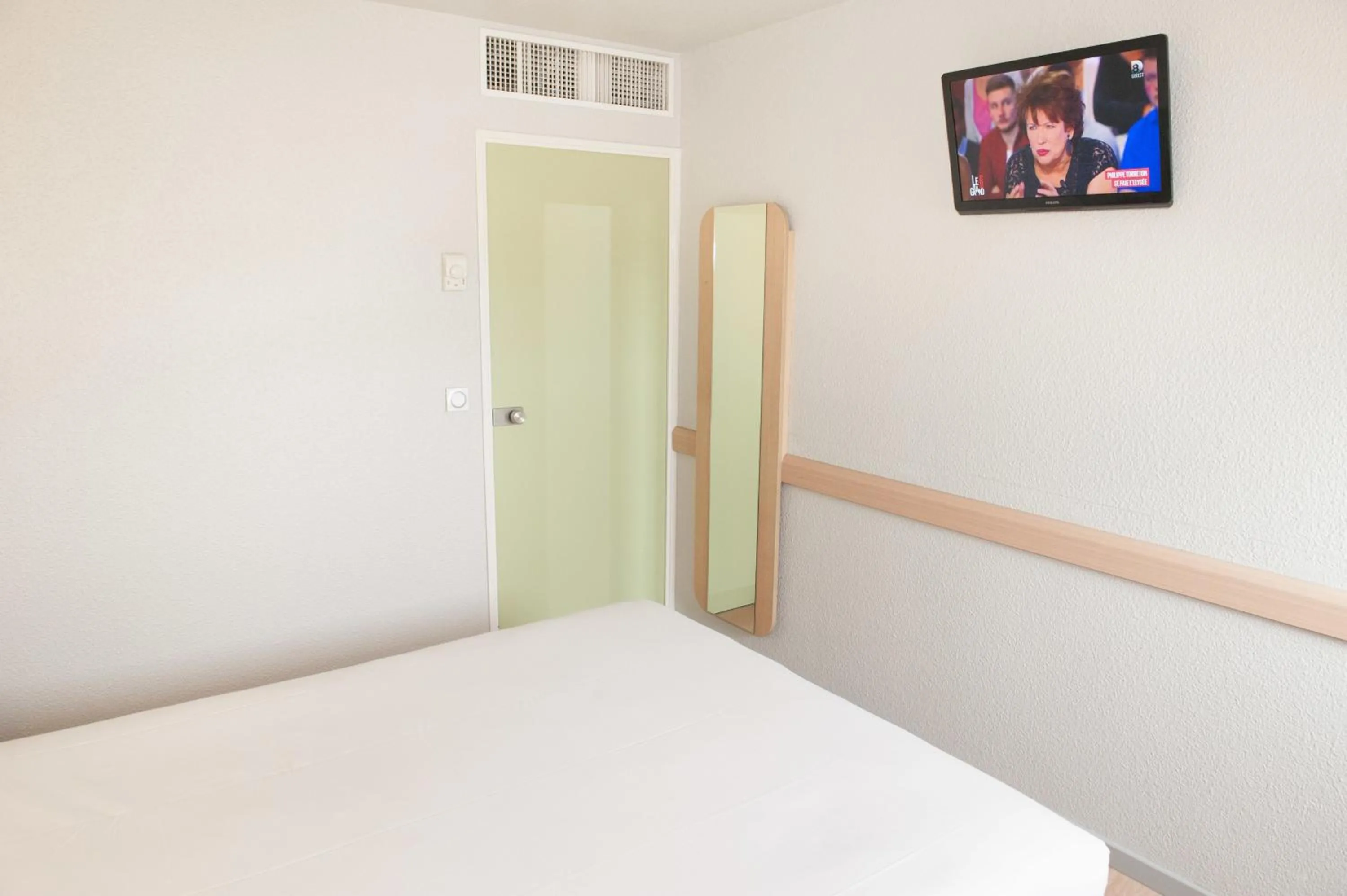 Decorative detail, Bed in ibis budget Goussainville Charles de Gaulle