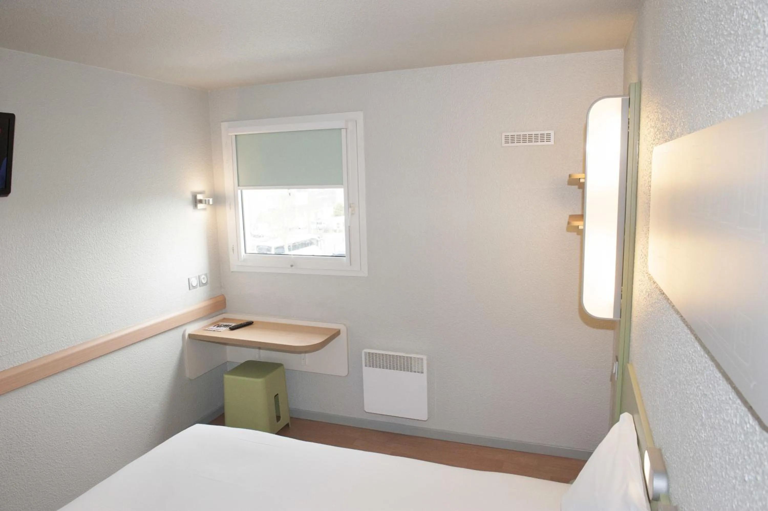 Decorative detail, Bed in ibis budget Goussainville Charles de Gaulle