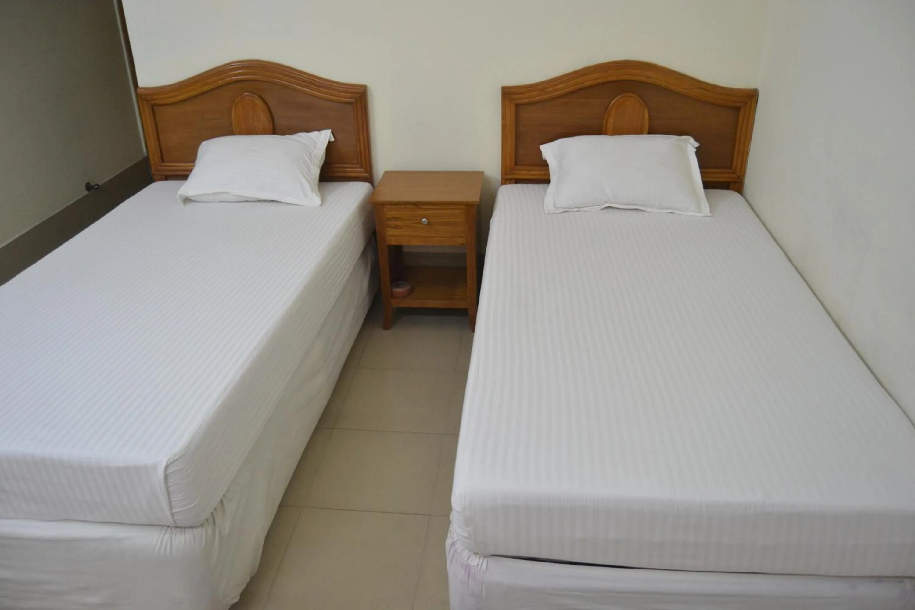 Bed in Hotel Marine Plaza
