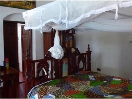 Bedroom in The Old Boma Hotel