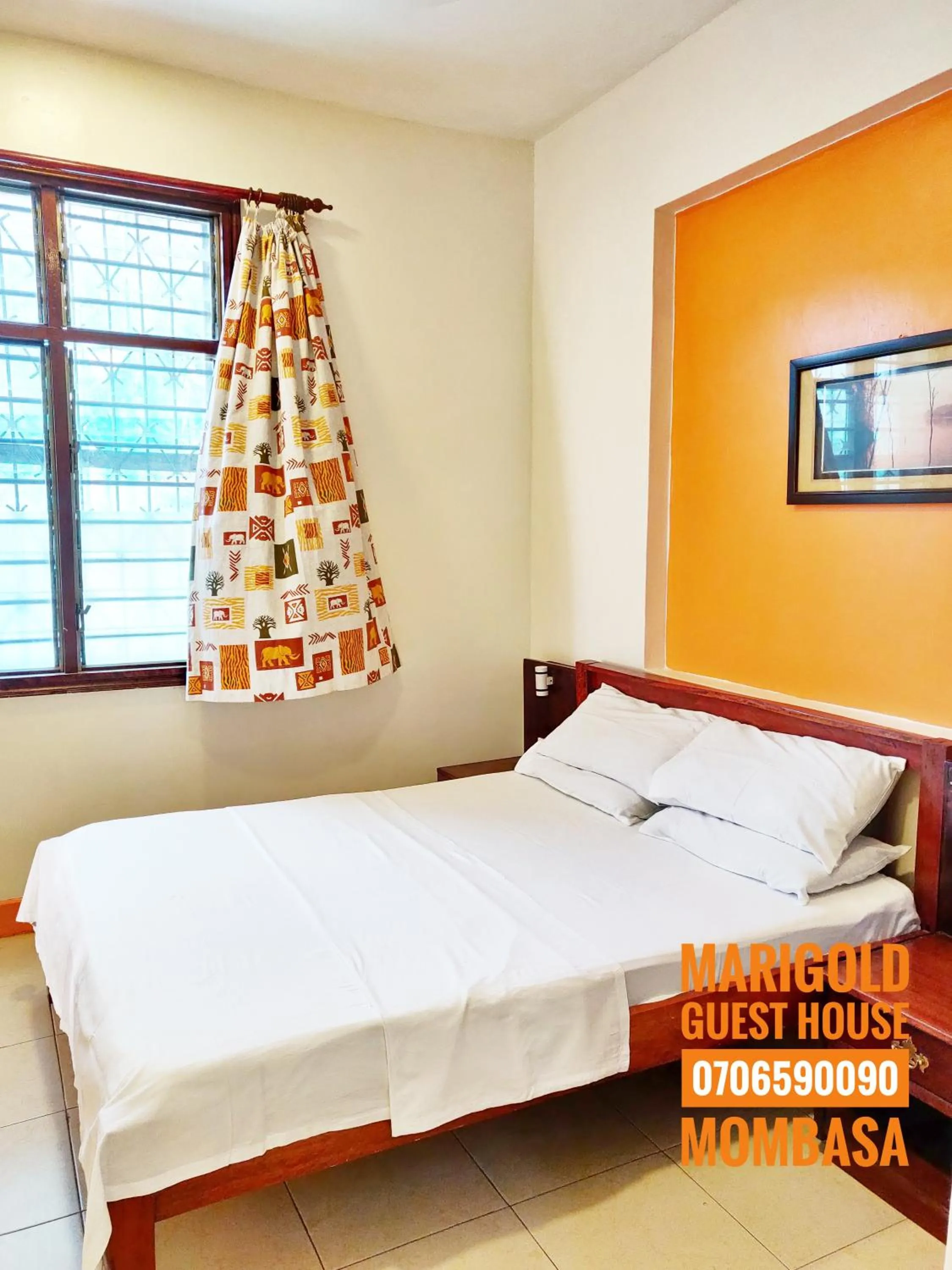 Bed in Marigold Guest House