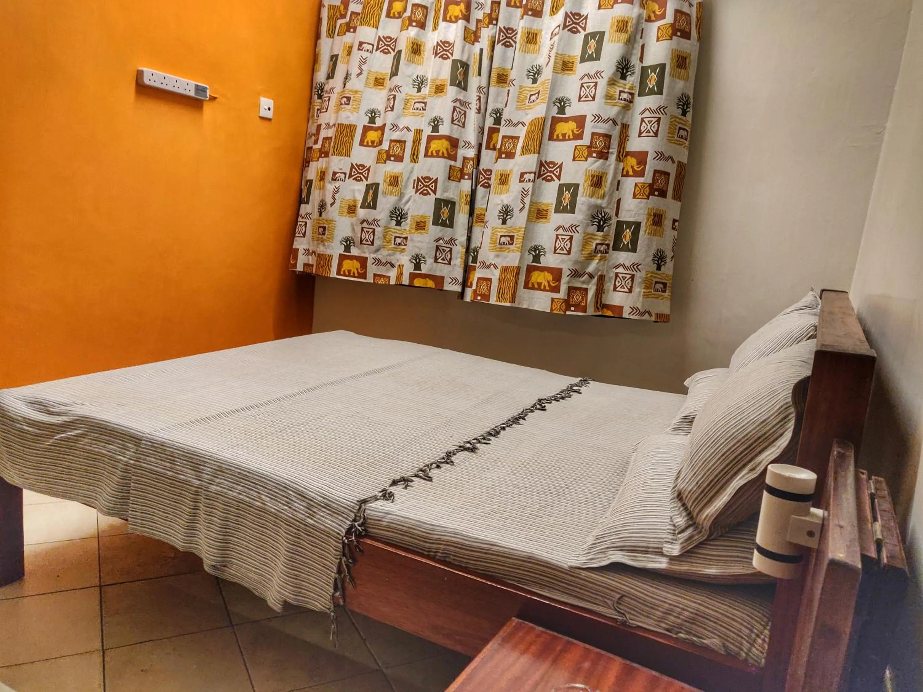 Bed in Marigold Guest House