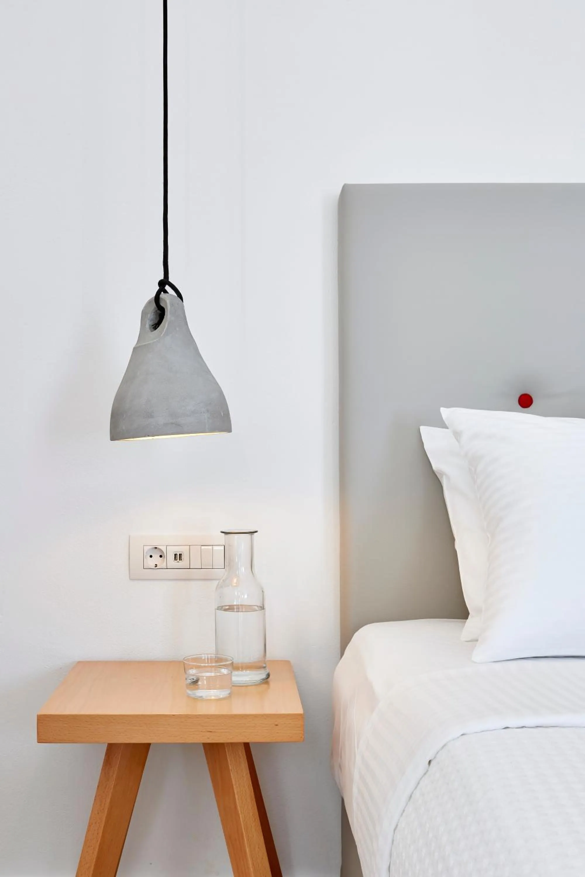 Bed in Aperanto Suites