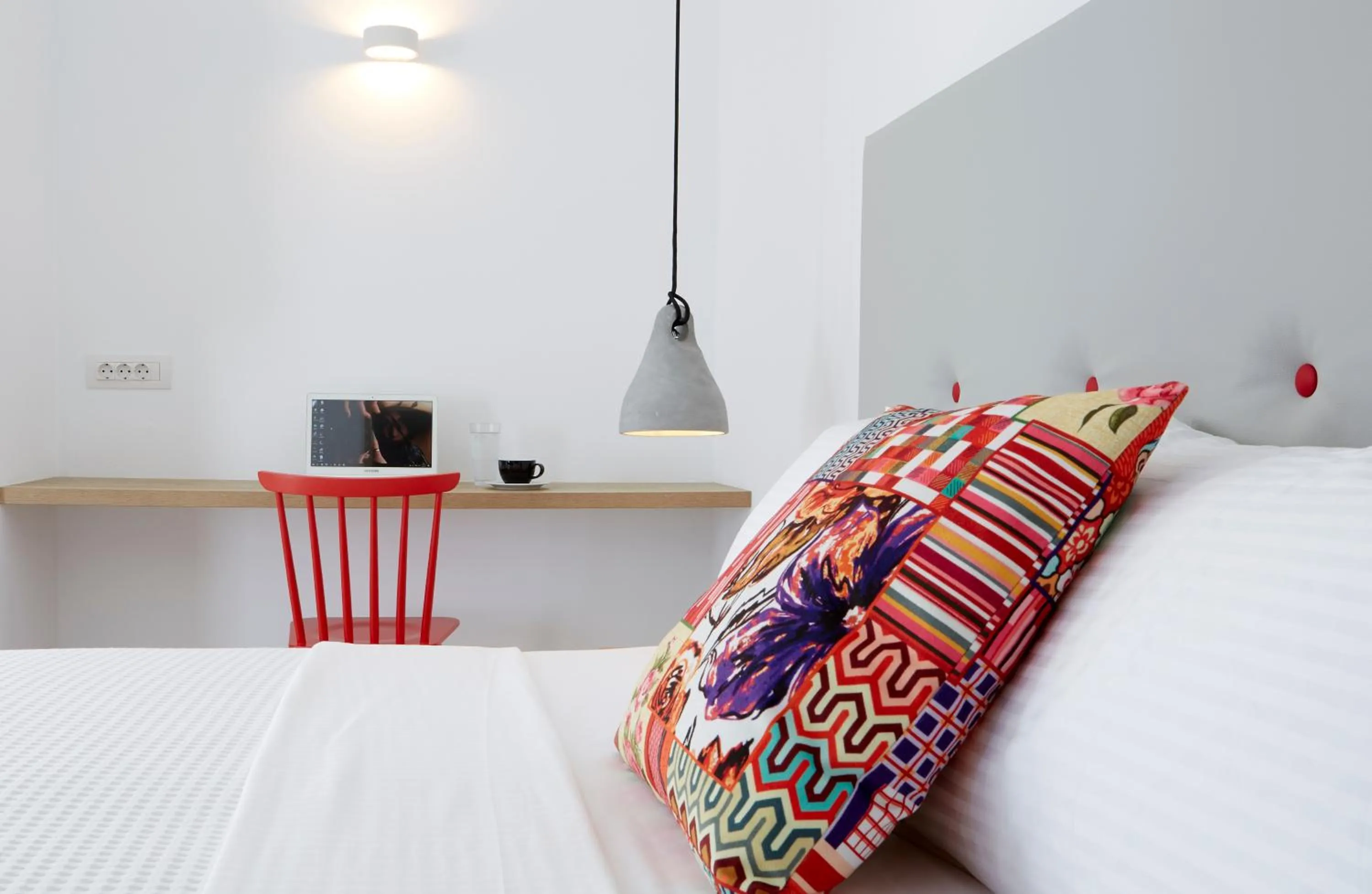 Bed in Aperanto Suites