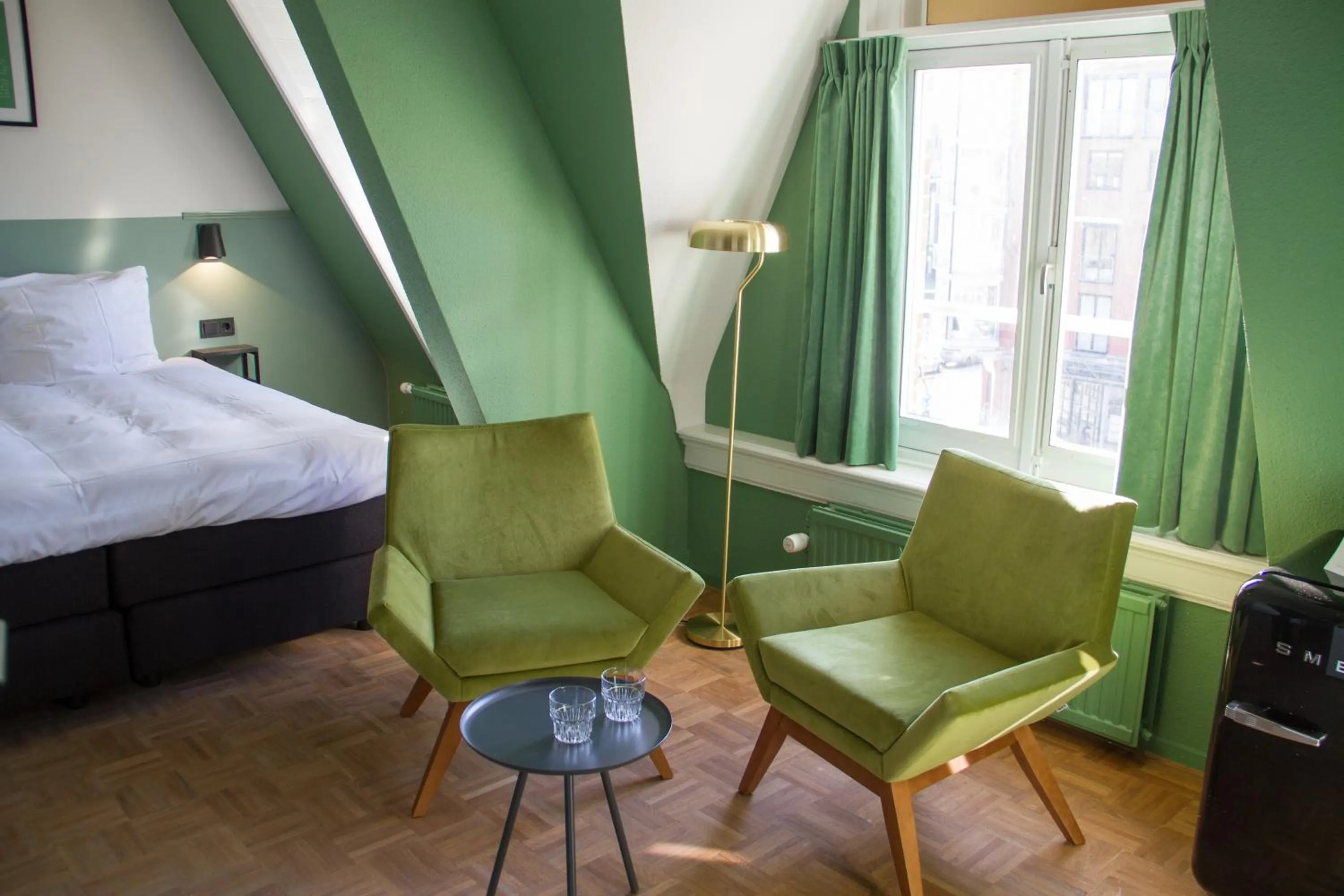 Seating area, Bed in Little Duke Hotel