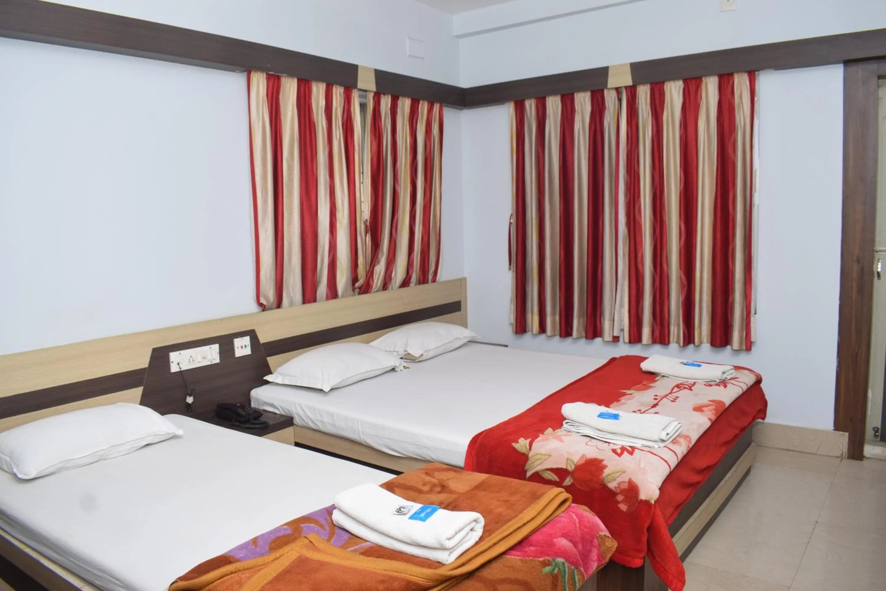 Bed in Hotel Srikrishna International