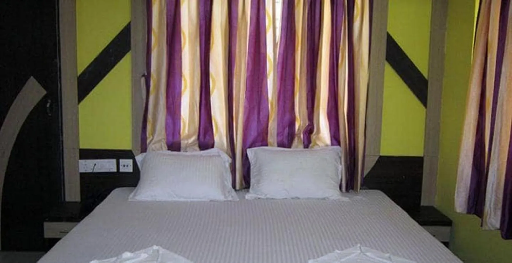 Bed in Hotel Srikrishna International