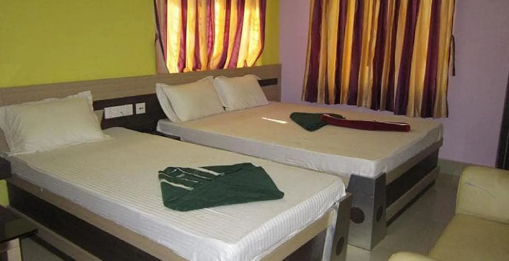 Bed in Hotel Srikrishna International