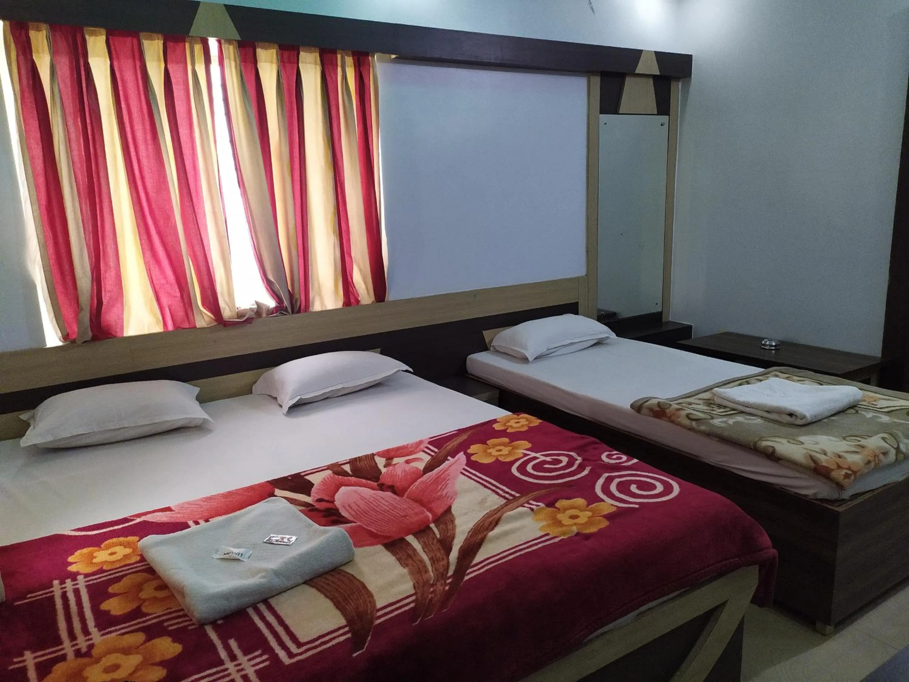 Bed in Hotel Srikrishna International