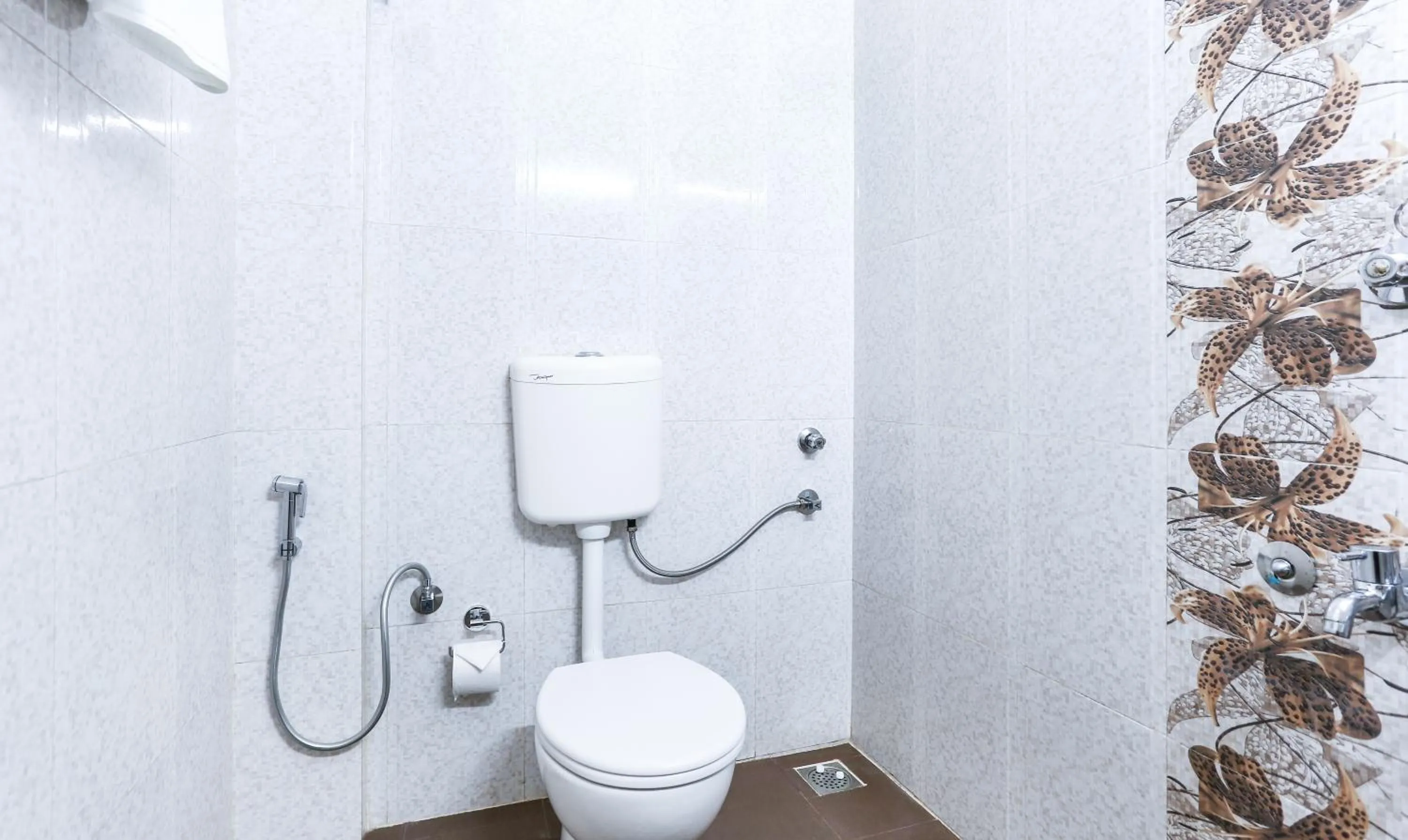 Bathroom in Treebo Comforts Inn, University Road Deralakatte