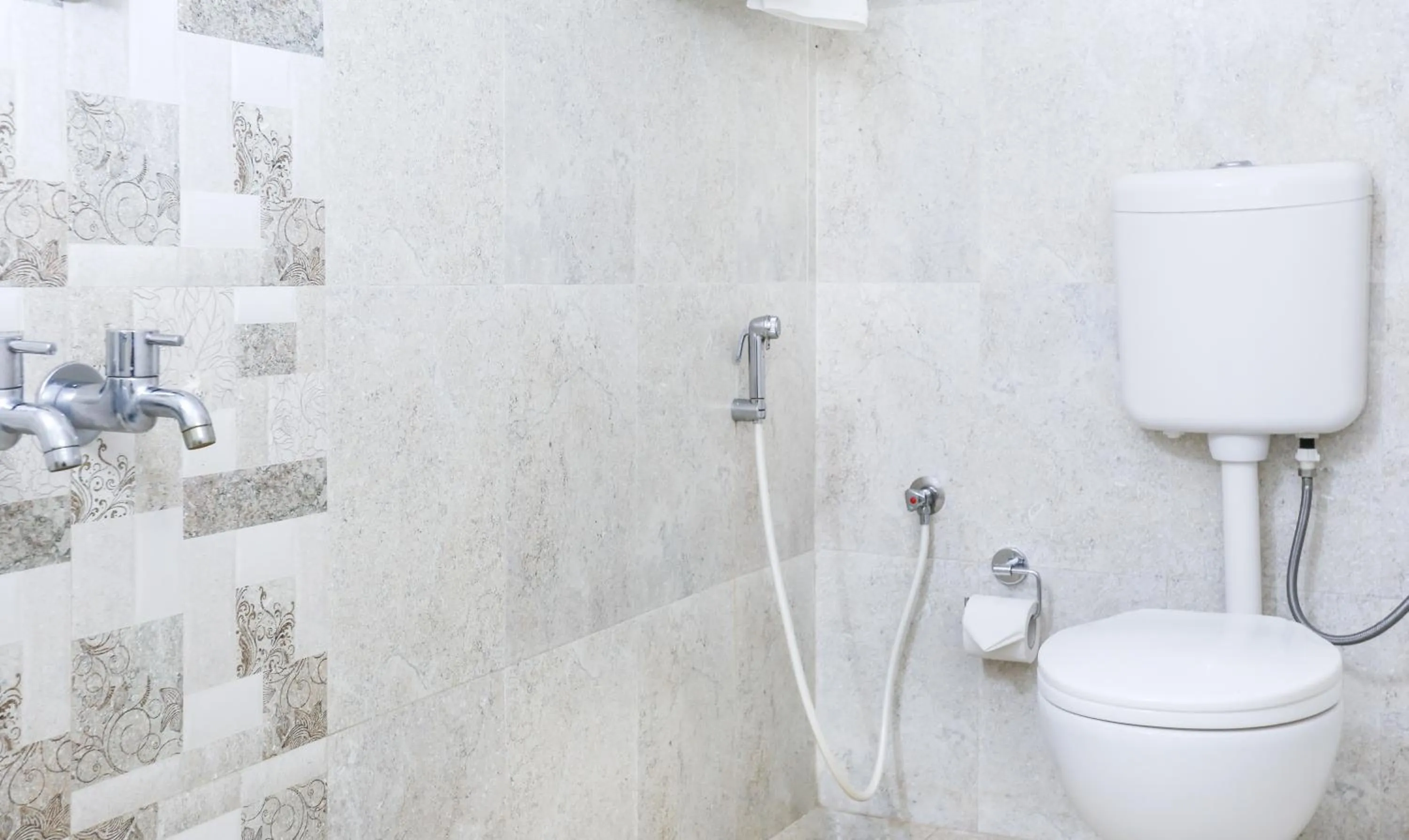 Bathroom in Treebo Comforts Inn, University Road Deralakatte