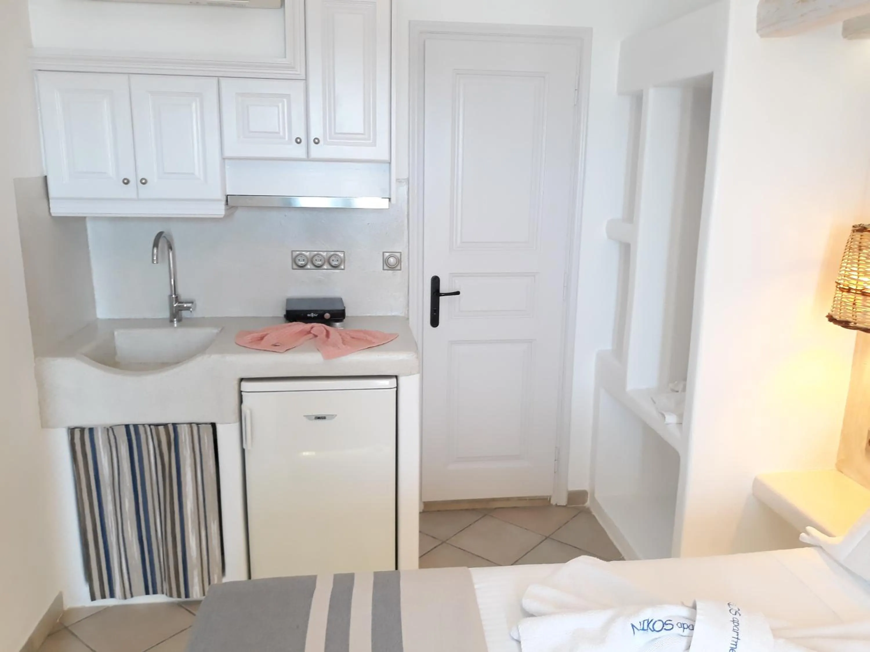 Kitchen or kitchenette in Nikos Apartments and Studios