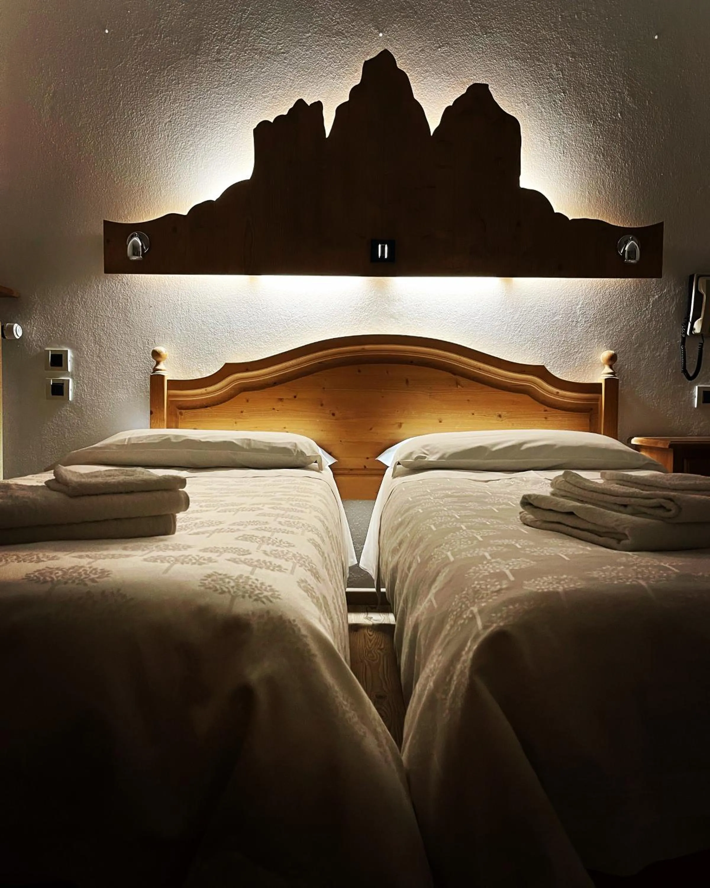 Bed in Hotel Dolomiti Des Alpes