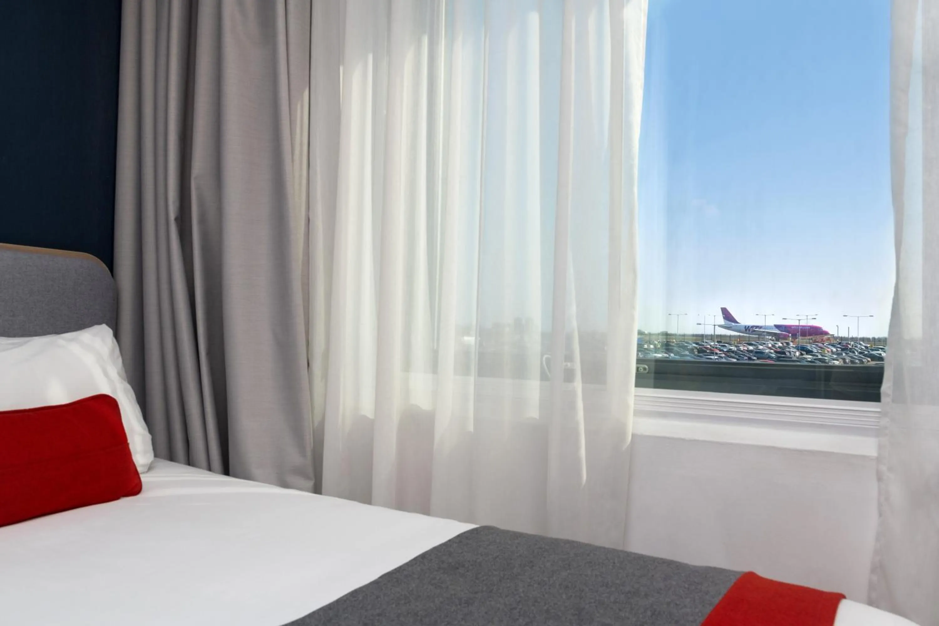 Bedroom, Bed in Holiday Inn Express London Luton Airport by IHG