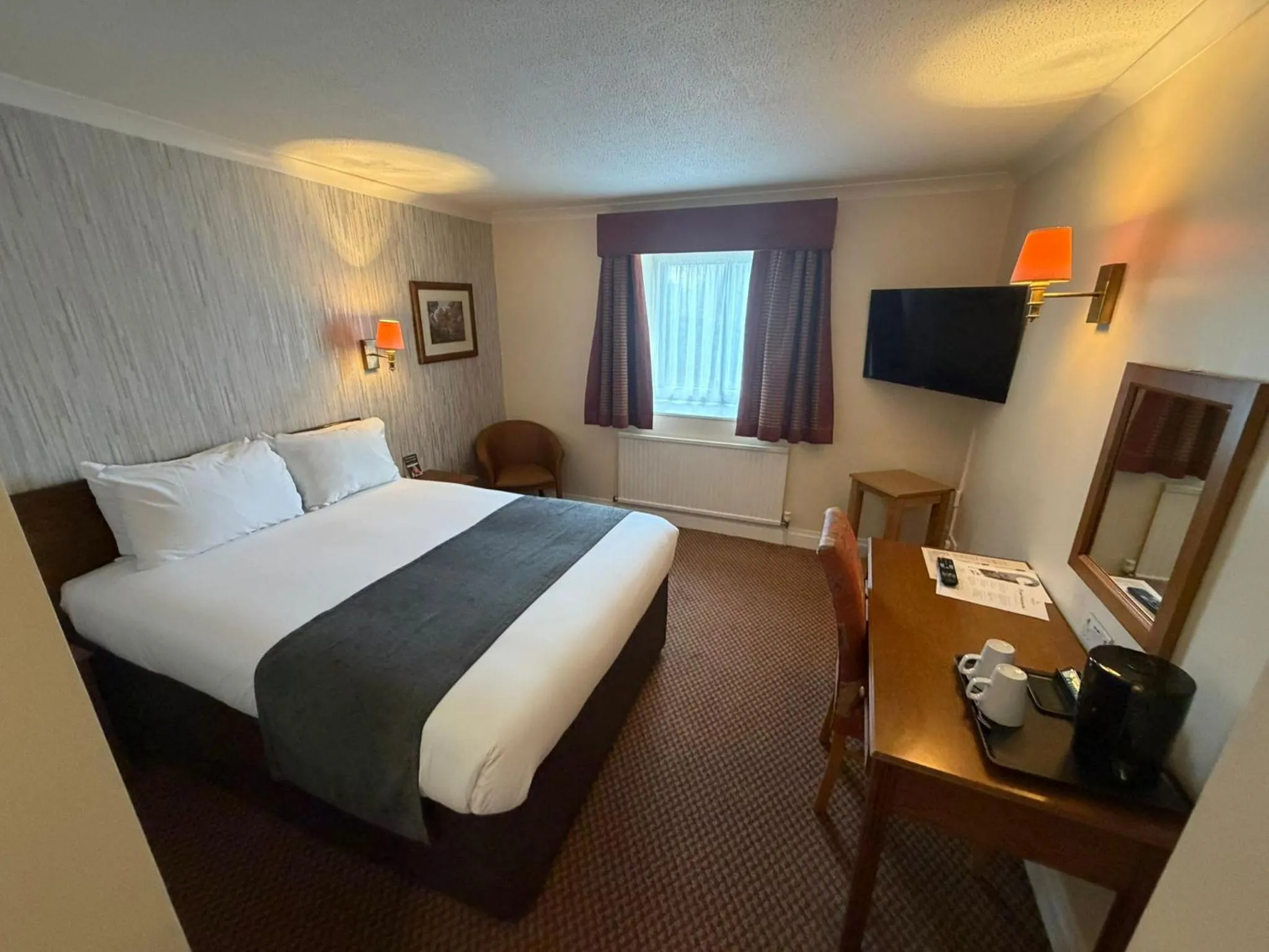 Bed in Raven Hotel by Greene King Inns