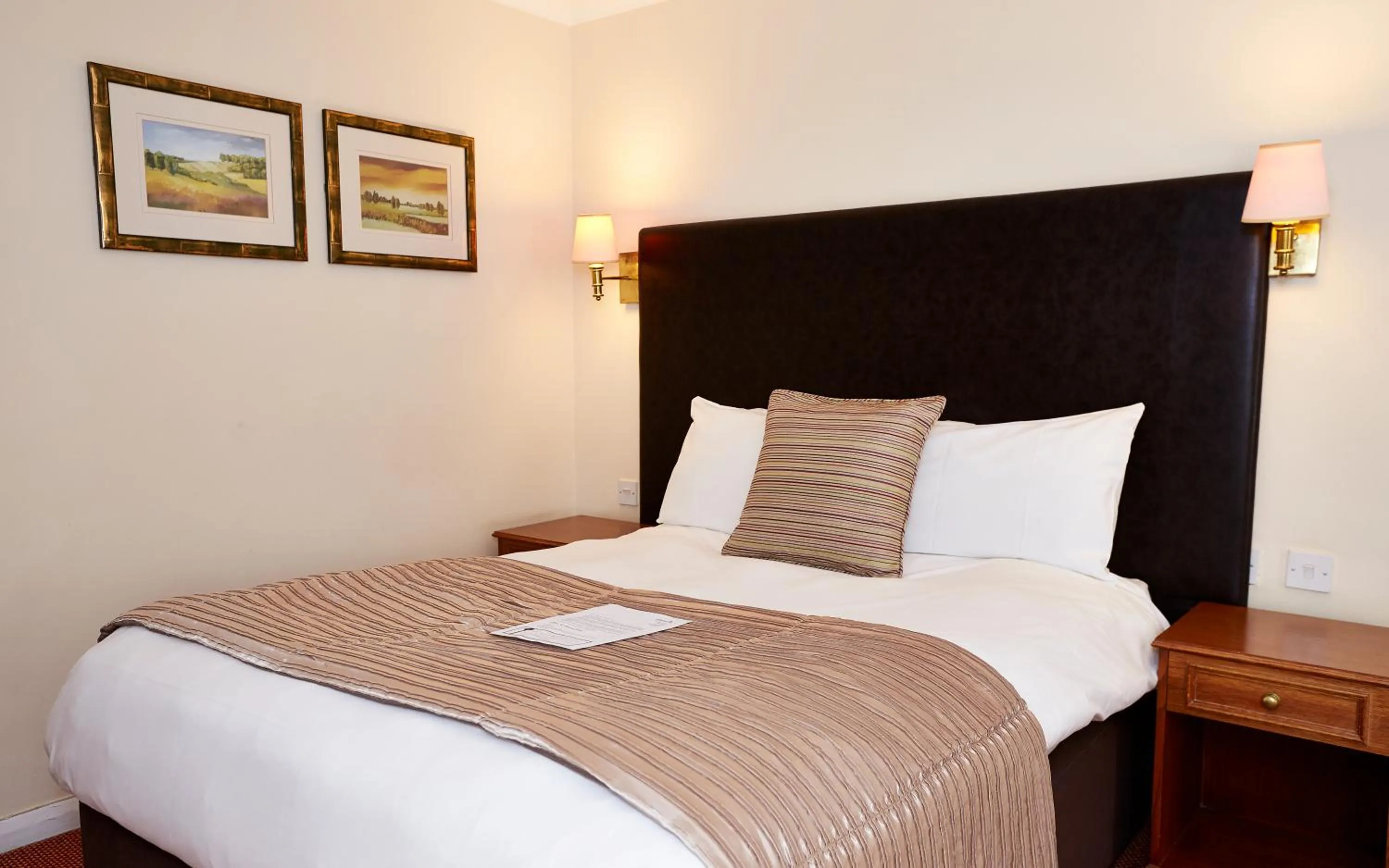 Bed in Raven Hotel by Greene King Inns