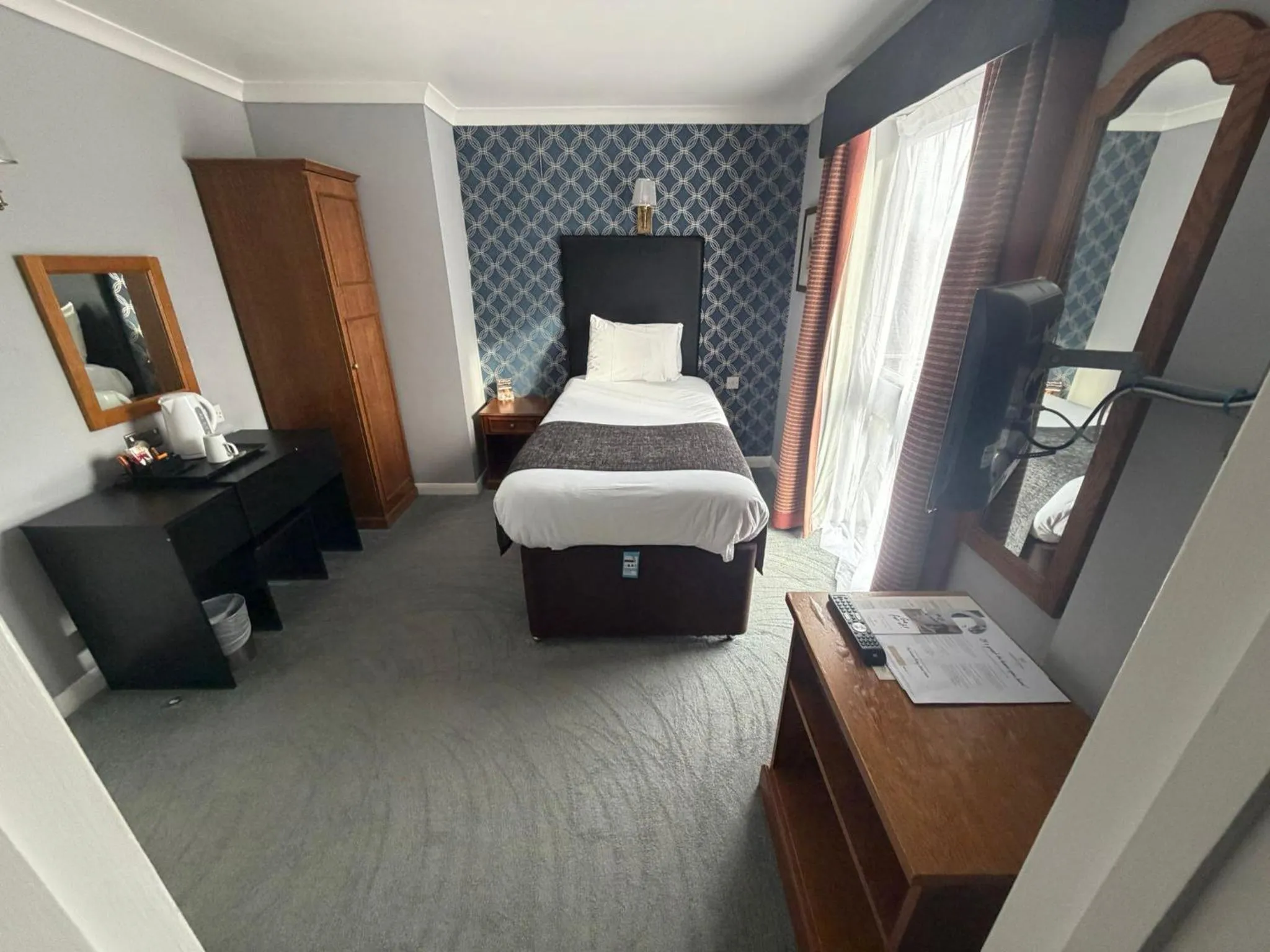 Bed in Raven Hotel by Greene King Inns