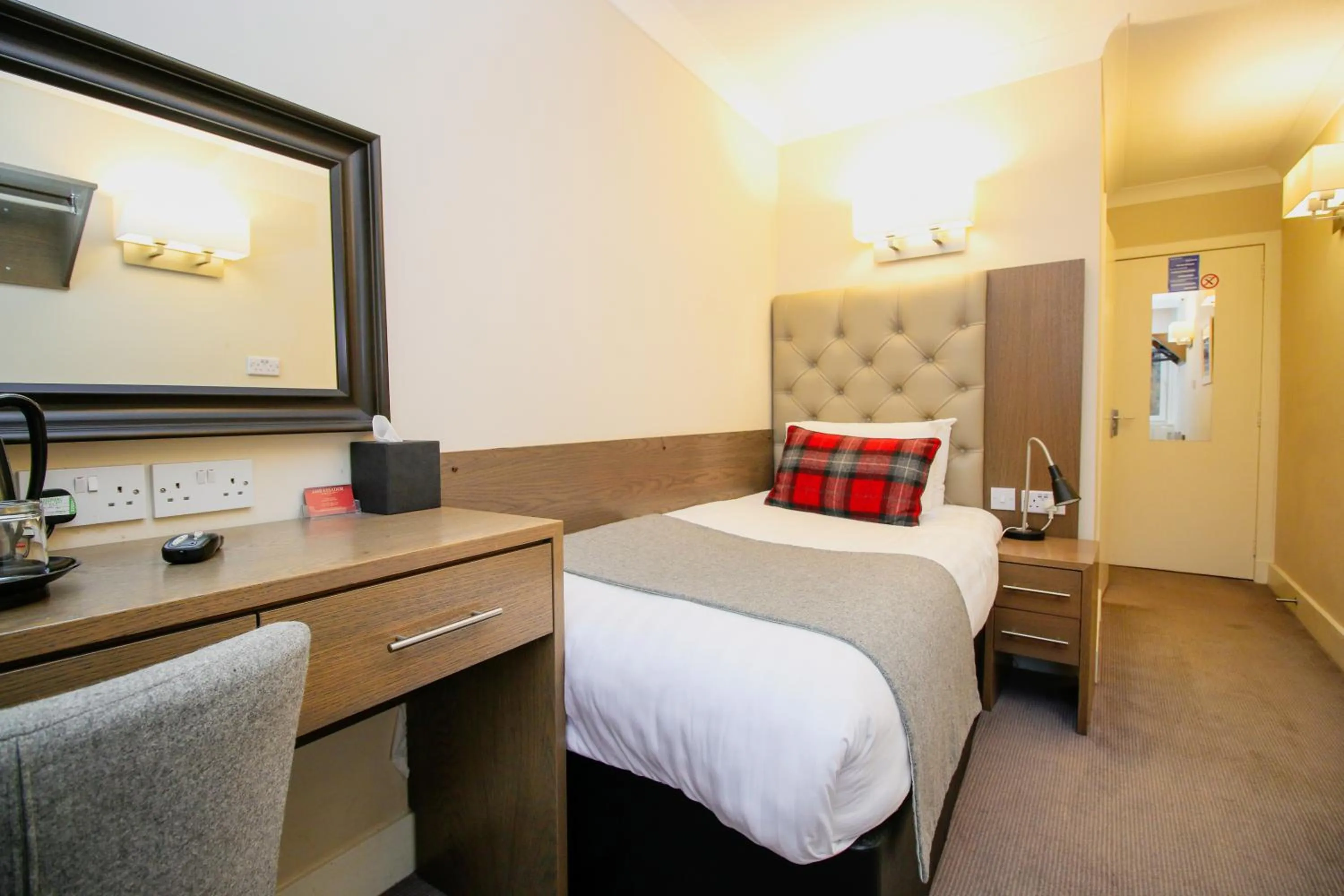 Bed in Ambassador Hotel