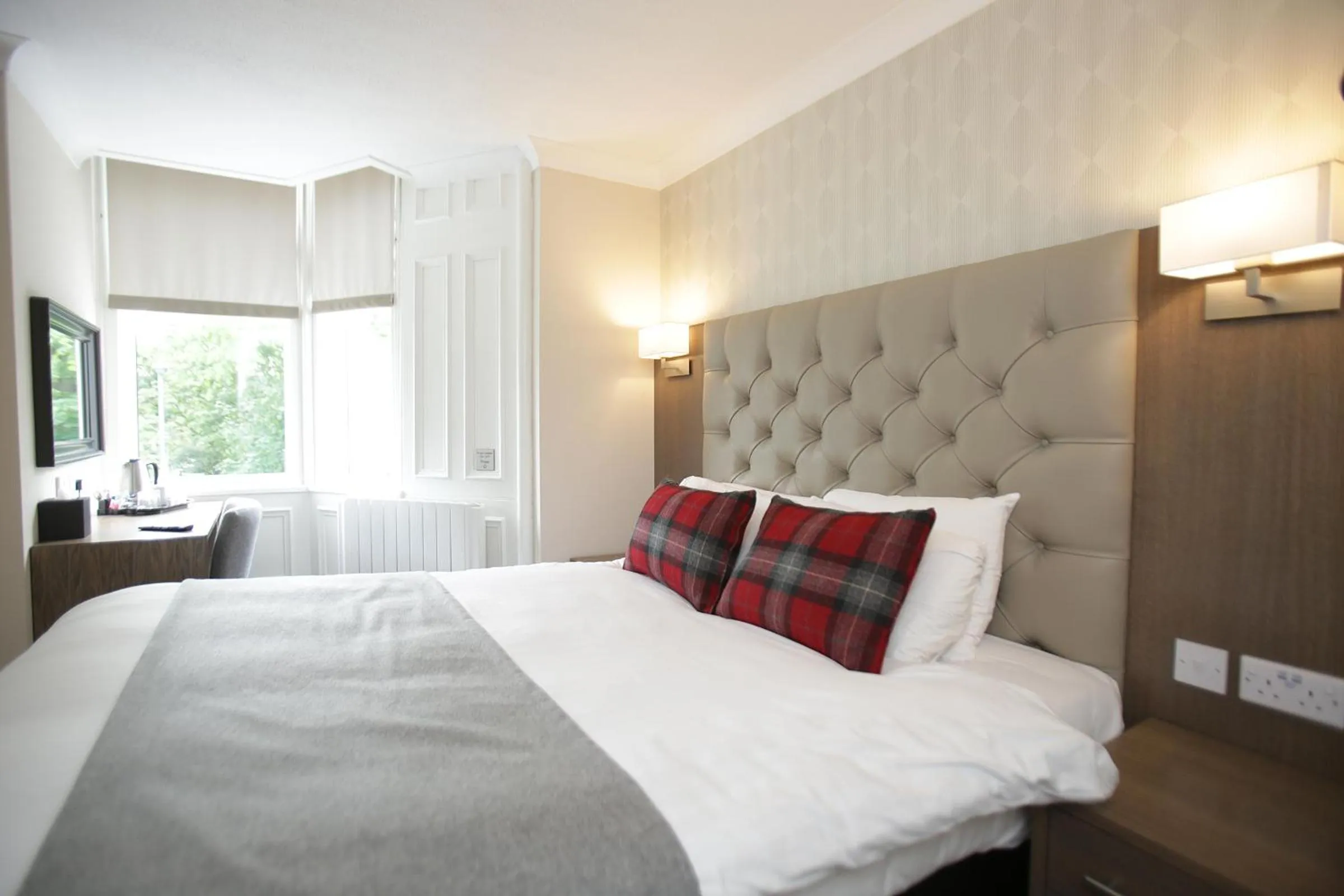 Bed in Ambassador Hotel