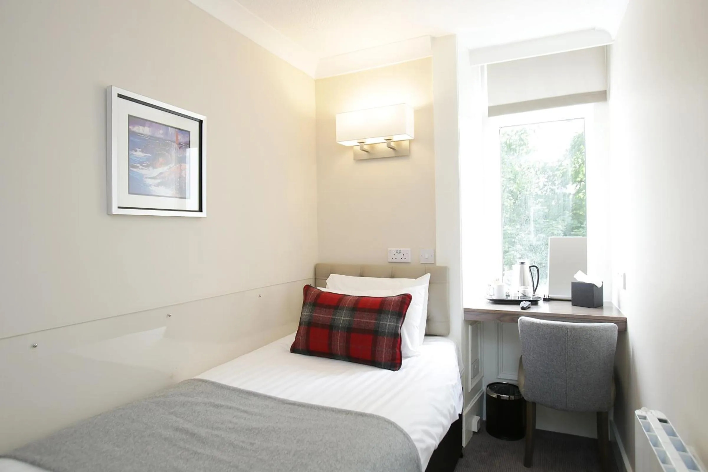 Bed in Ambassador Hotel