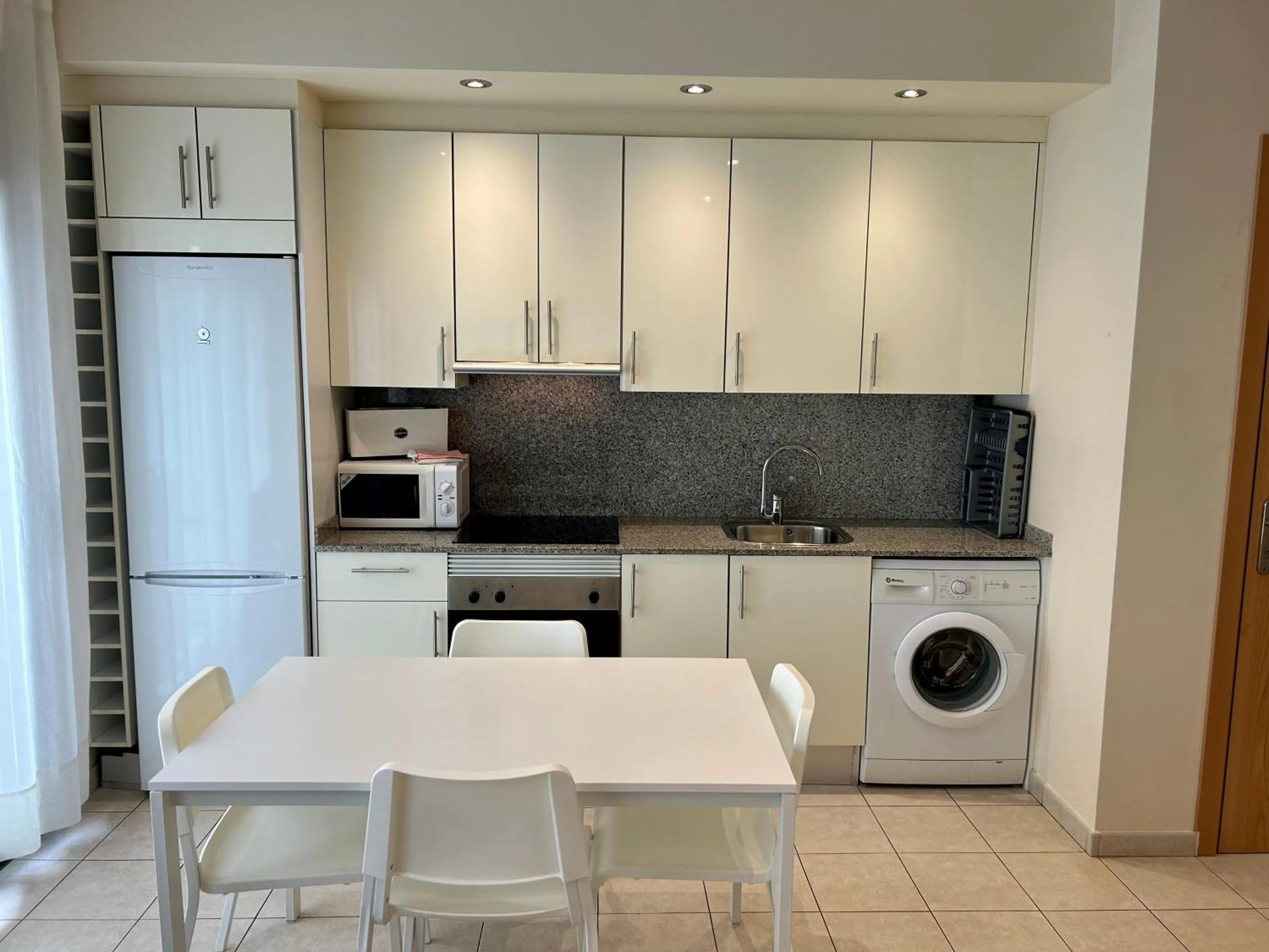 Kitchen or kitchenette in Apartamentos TDM