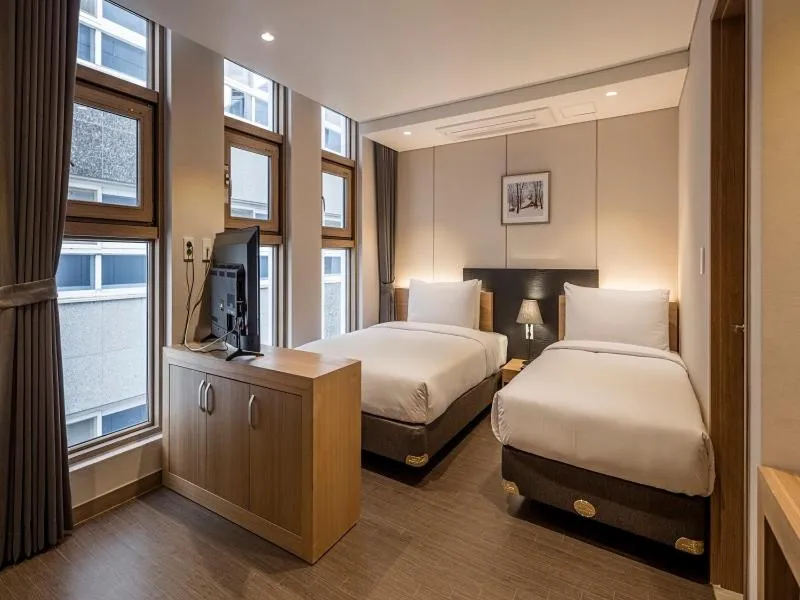 Bed in The First Stay Hotel