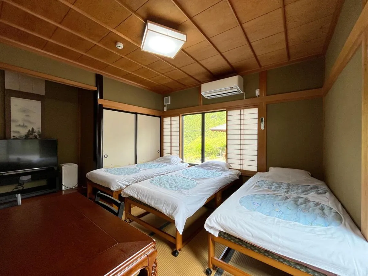 Bed in Minshuku Ryokan Kawai