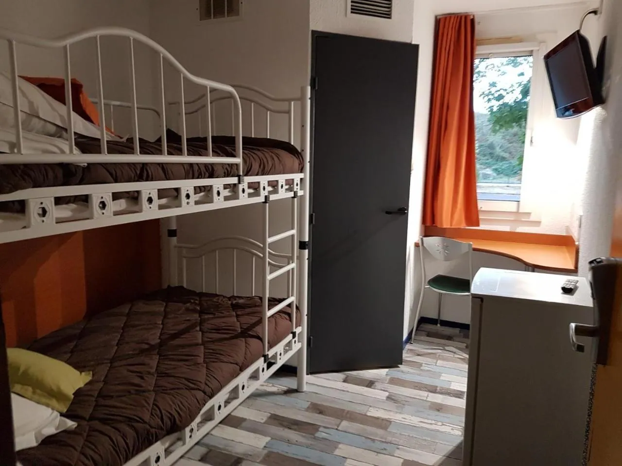 Bed in Welcomotel Limoges