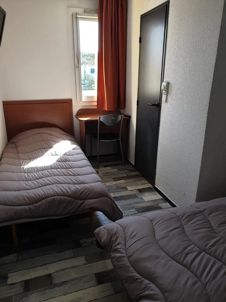 Bed in Welcomotel Limoges