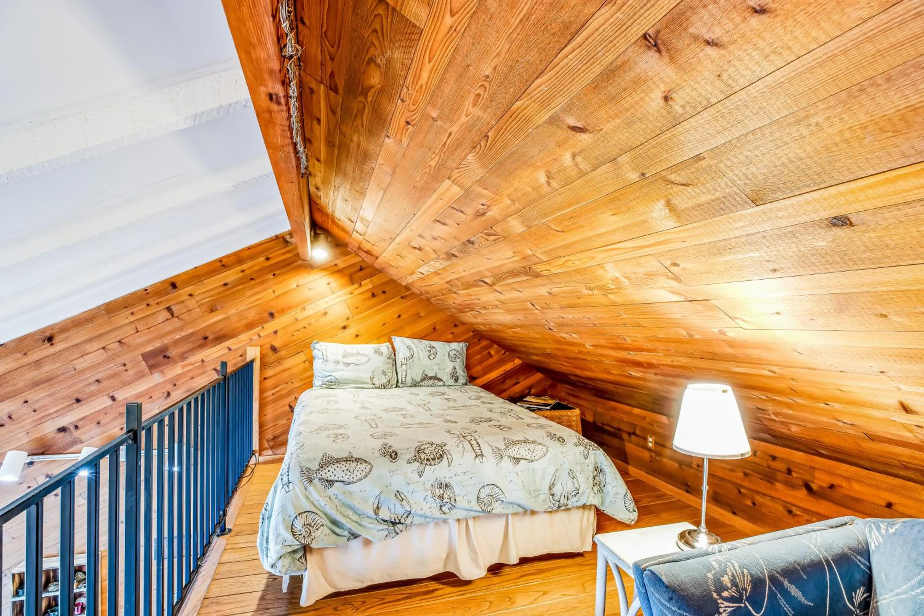 Bed in Blue Sea Oceanfront Cottage