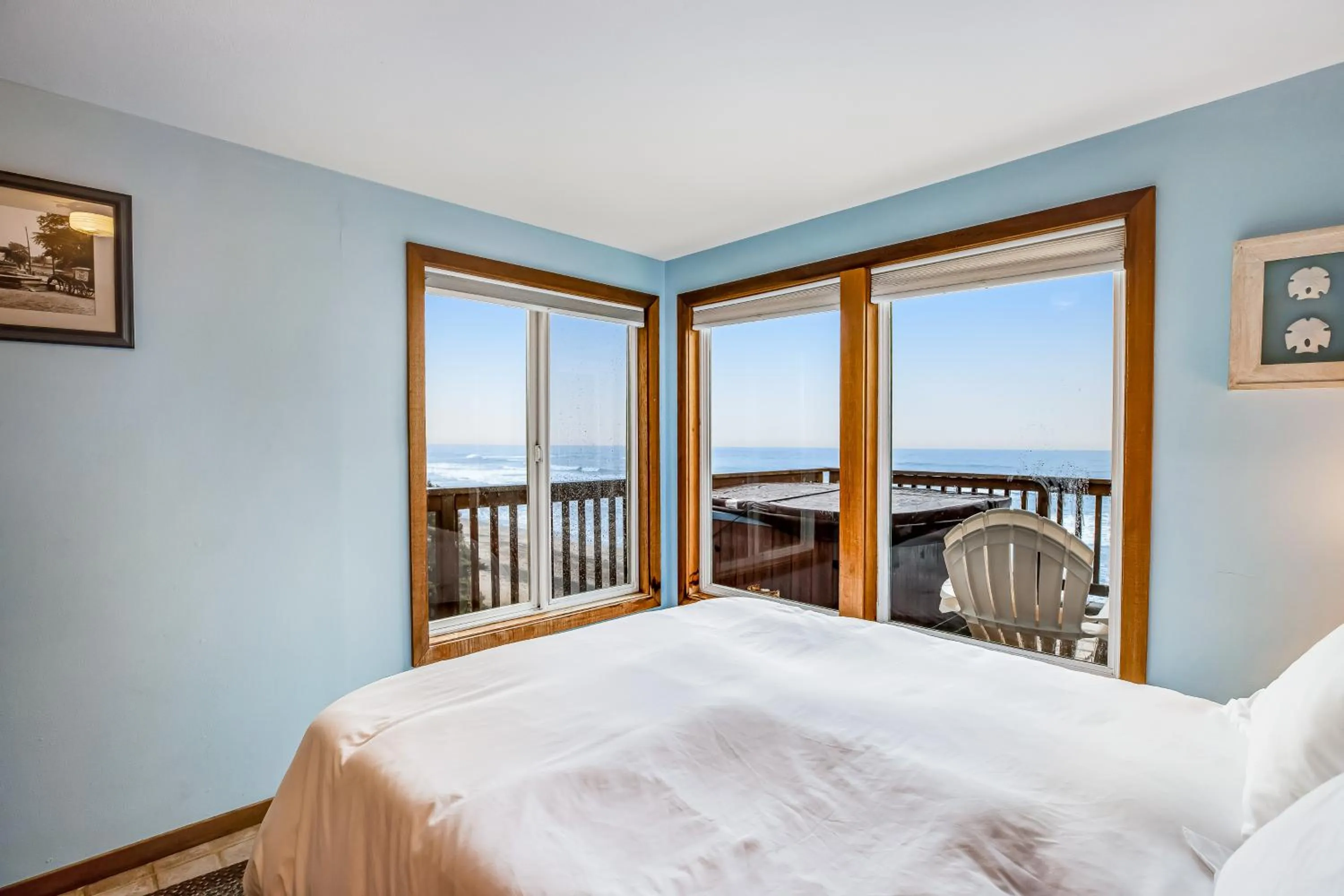 Bed in Blue Sea Oceanfront Cottage