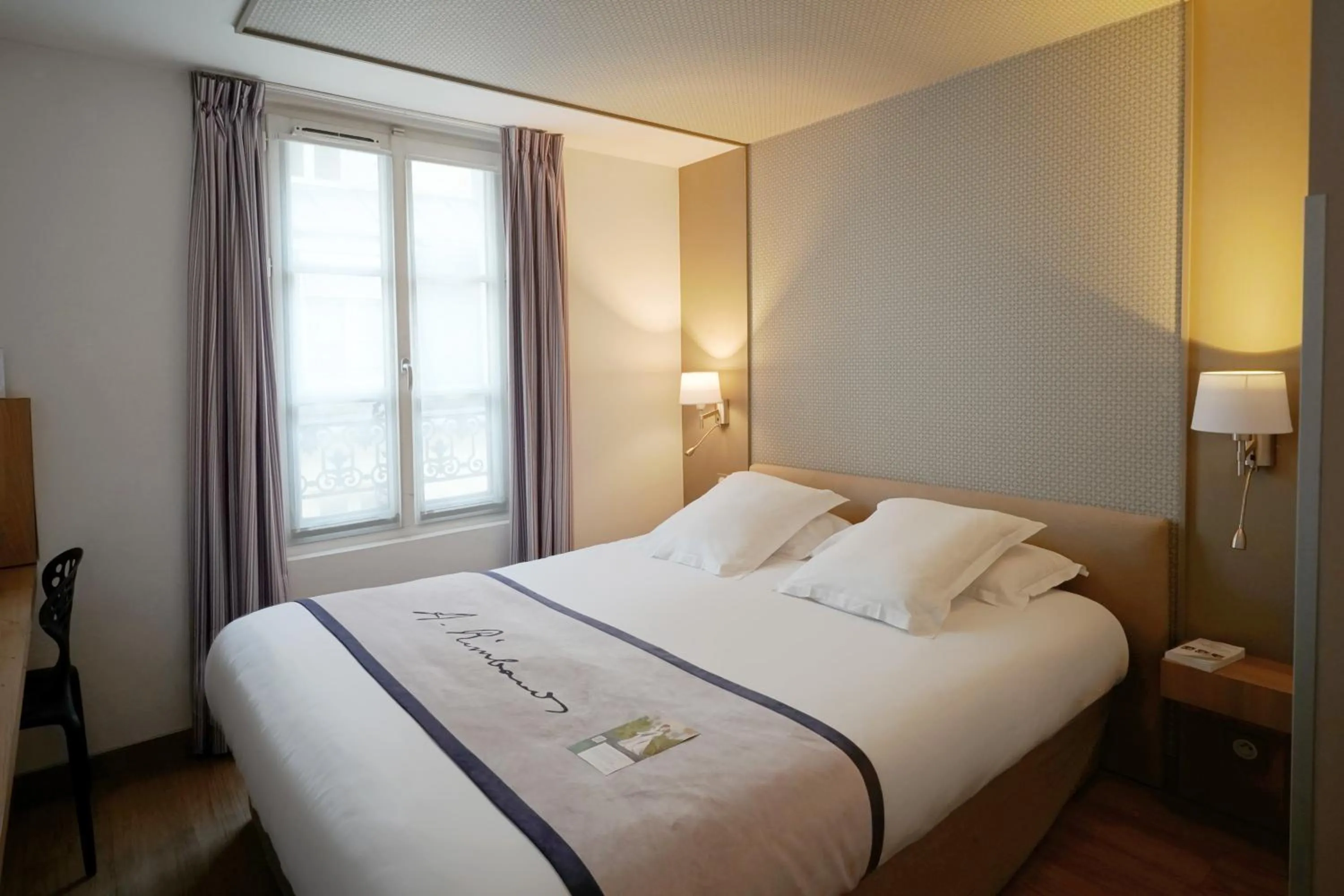 Bed in Hôtel Littéraire Arthur Rimbaud, BW Signature Collection