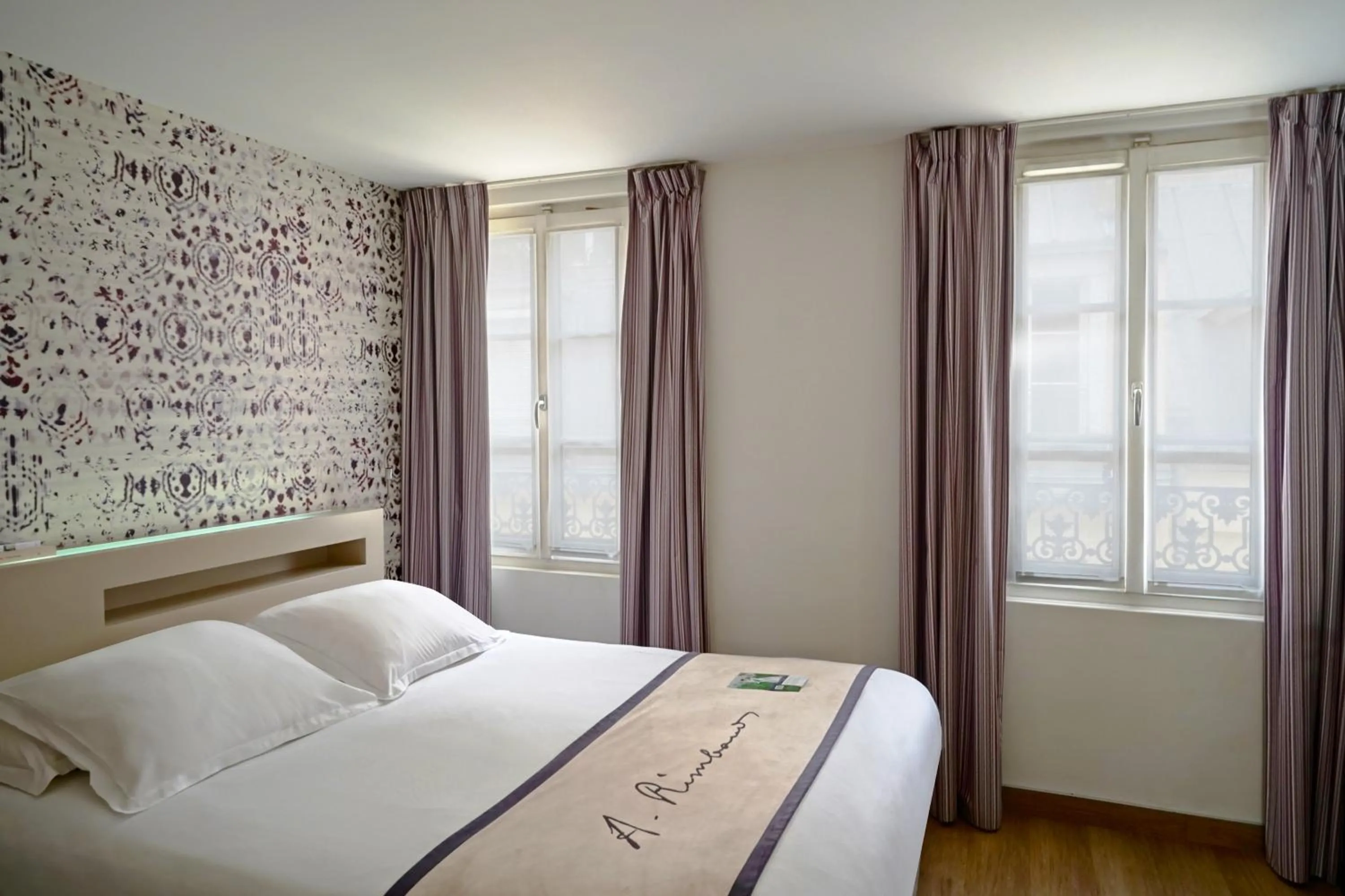 Bed in Hôtel Littéraire Arthur Rimbaud, BW Signature Collection